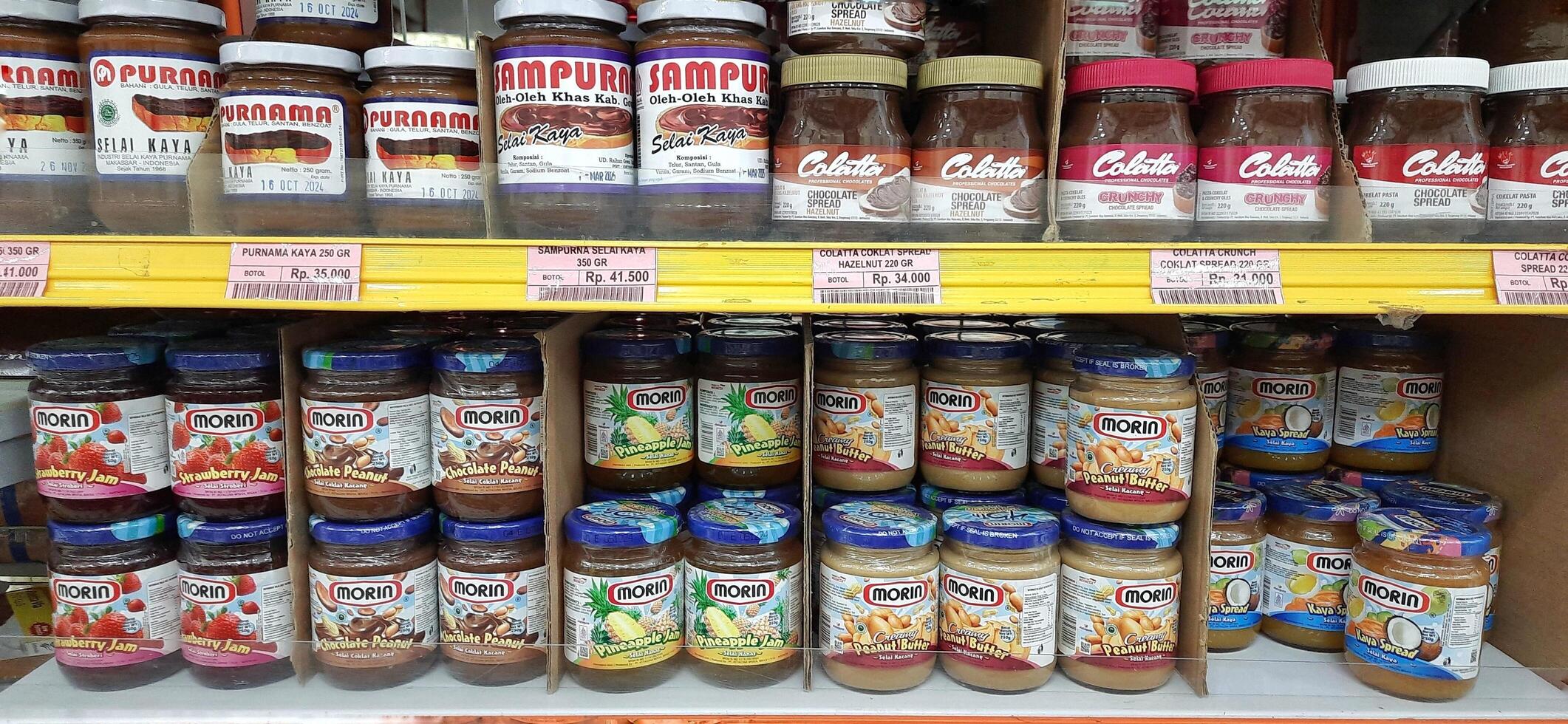 Coang supermarket shelf display. One of the complete cake and food equipment and ingredients stores in Makassar. South Sulawesi, Indonesia - August 7 2024 photo
