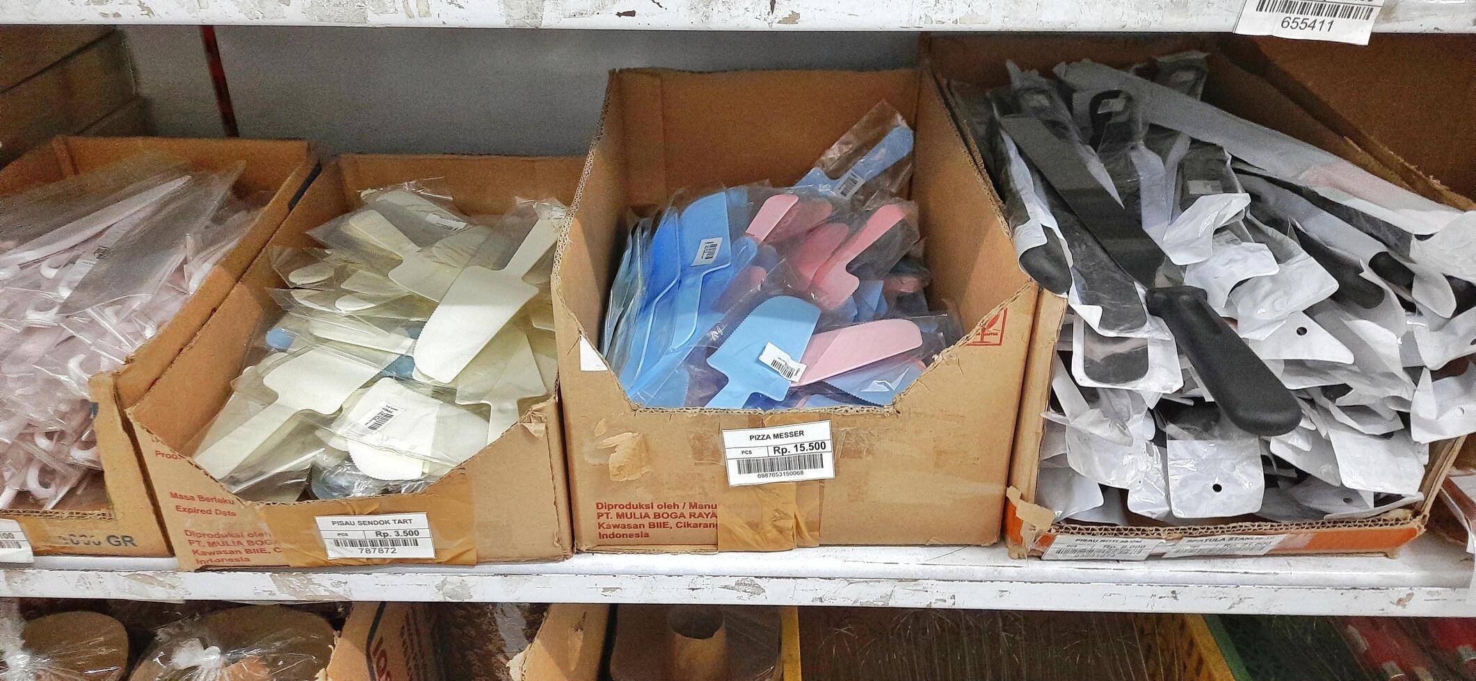 Coang supermarket shelf display. One of the complete cake and food equipment and ingredients stores in Makassar. South Sulawesi, Indonesia - August 7 2024 photo