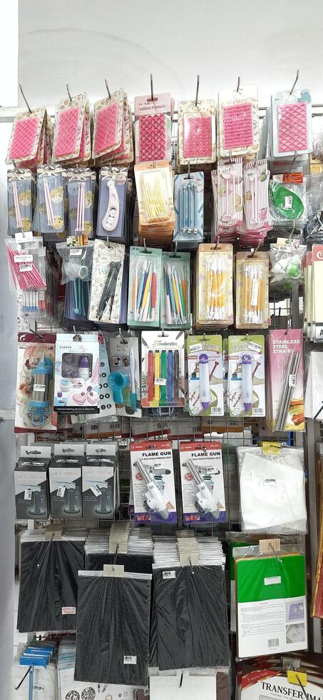Coang supermarket shelf display. One of the complete cake and food equipment and ingredients stores in Makassar. South Sulawesi, Indonesia - August 7 2024 photo