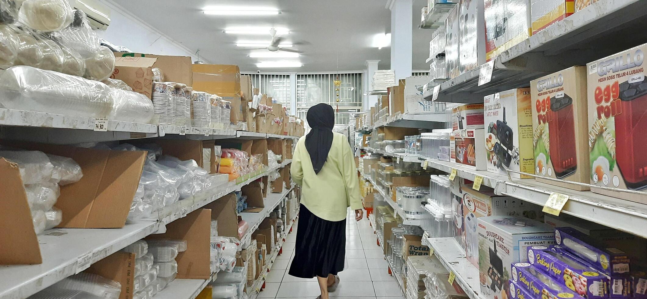 Coang supermarket shelf display. One of the complete cake and food equipment and ingredients stores in Makassar. South Sulawesi, Indonesia - August 7 2024 photo