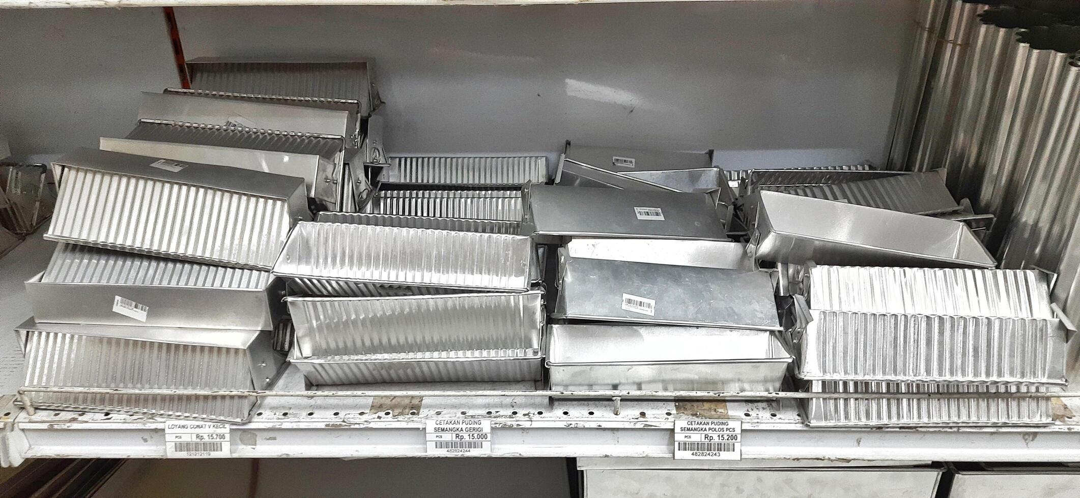 Coang supermarket shelf display. One of the complete cake and food equipment and ingredients stores in Makassar. South Sulawesi, Indonesia - August 7 2024 photo