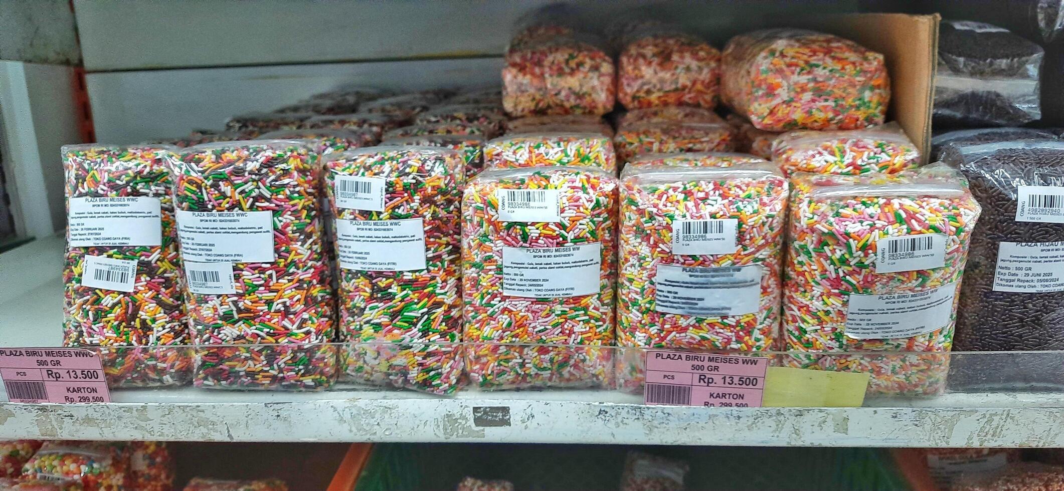 Coang supermarket shelf display. One of the complete cake and food equipment and ingredients stores in Makassar. South Sulawesi, Indonesia - August 7 2024 photo