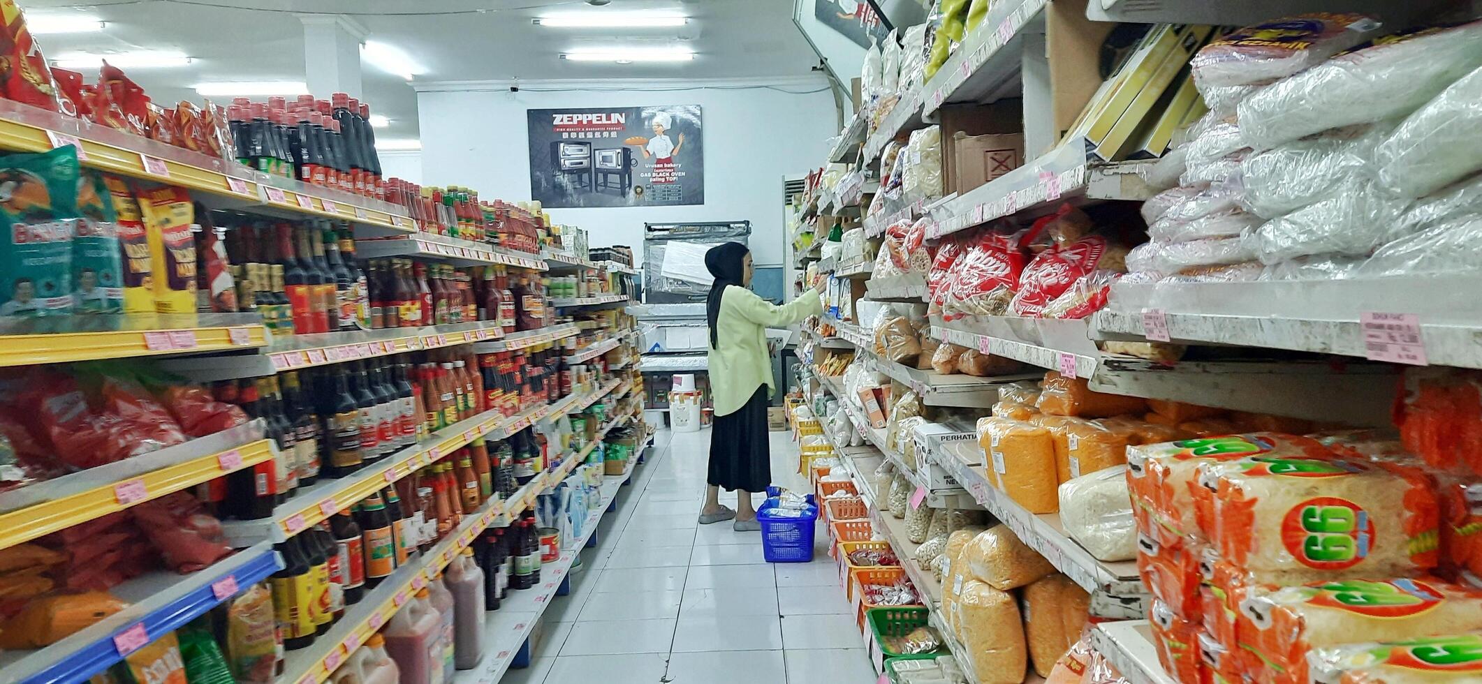Coang supermarket shelf display. One of the complete cake and food equipment and ingredients stores in Makassar. South Sulawesi, Indonesia - August 7 2024 photo