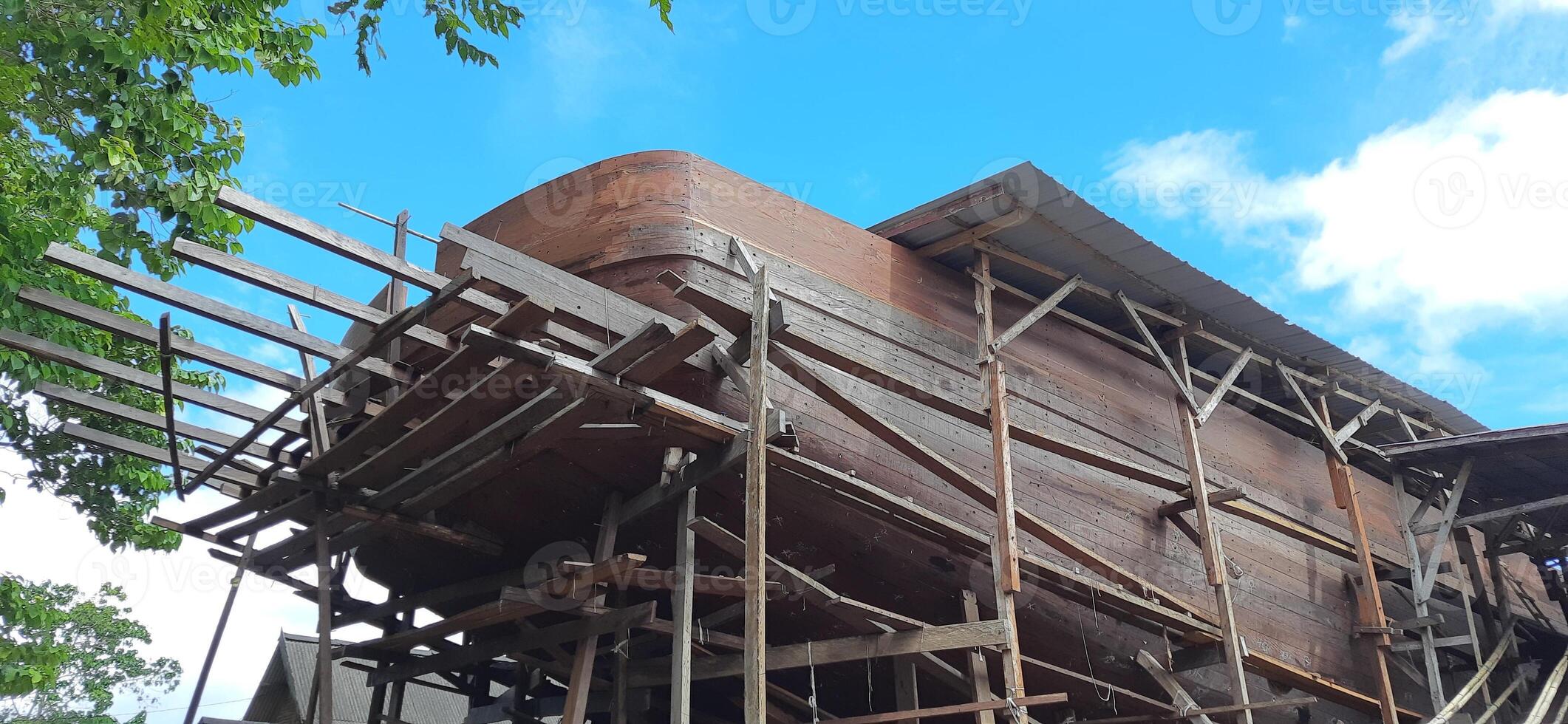 Manufacturing of construction traditional phinisi wooden boats bulukumba. South Sulawesi, Indonesia - July 29 2024 photo