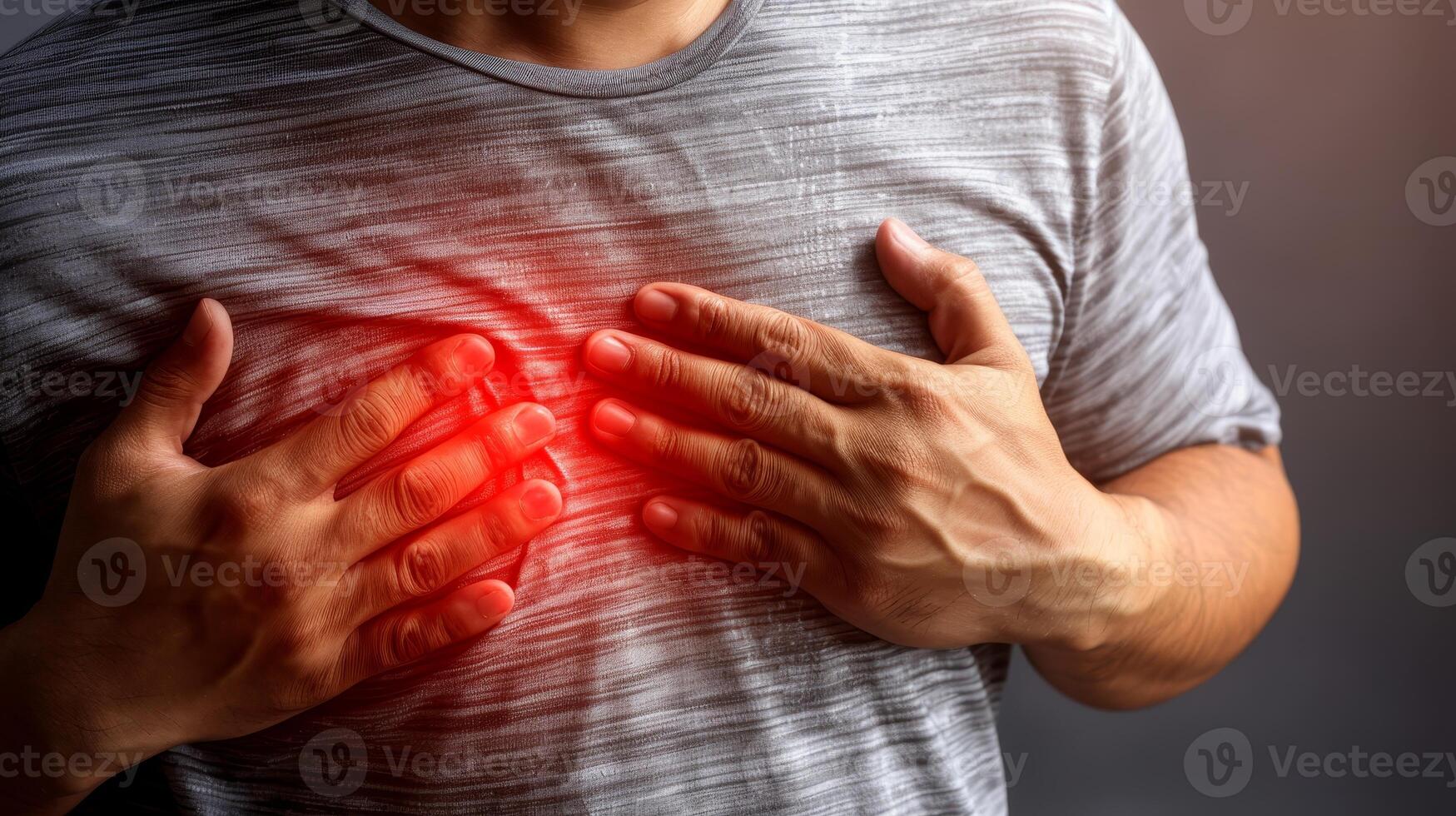 Closeup of man suffering from chest pain, heart attack or other health problem concept photo