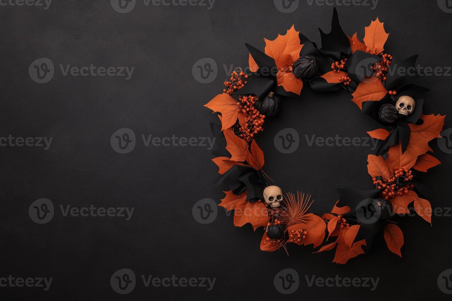 A spooky wreath made of black and orange ribbons, with small skulls and bats photo