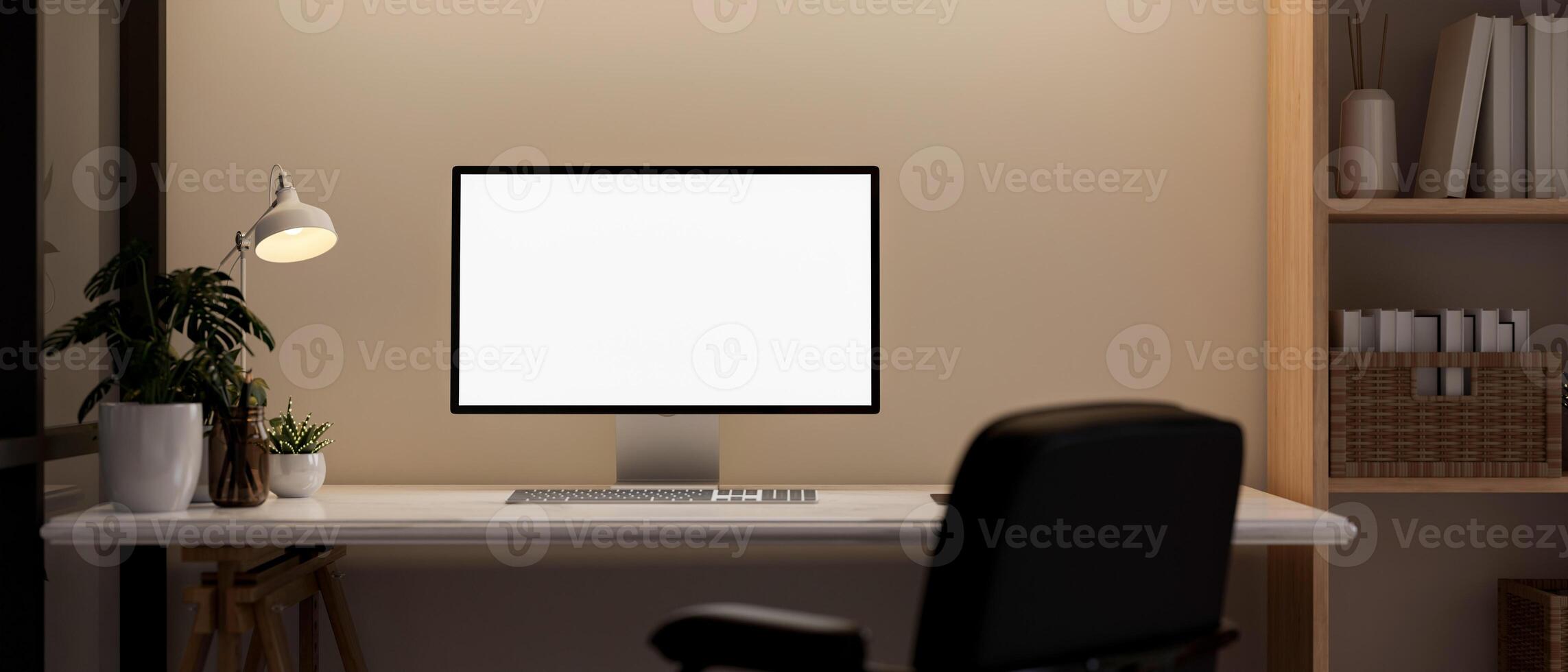 Front view of a computer desk in a contemporary room, a computer mockup on a table against the wall. photo