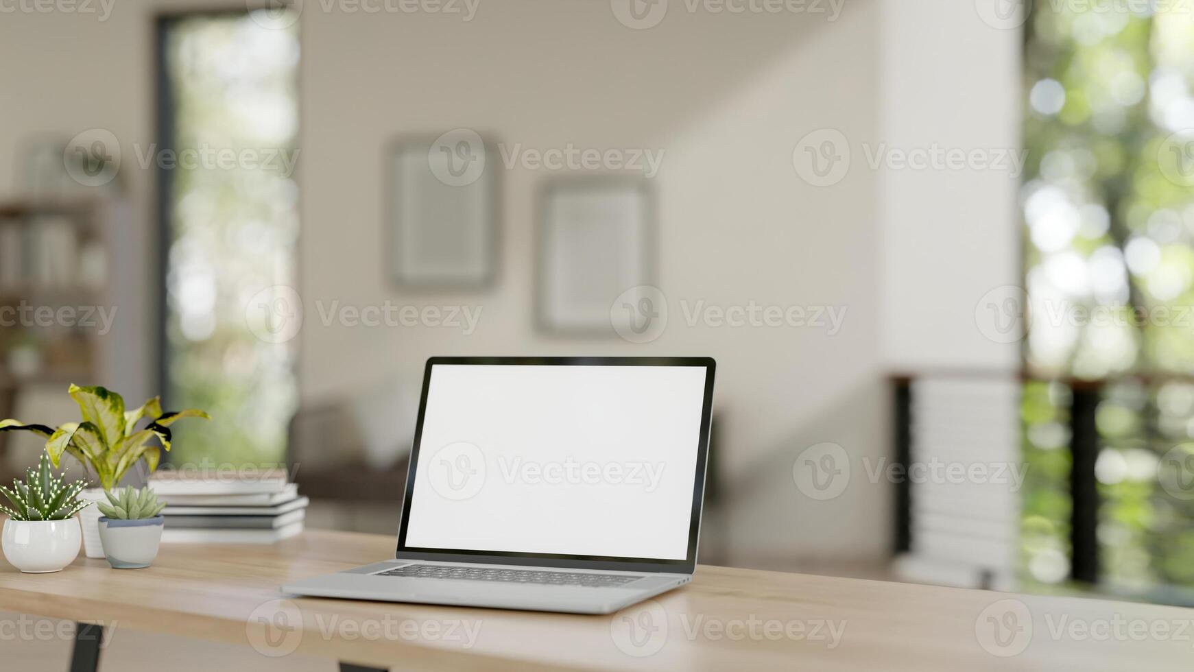 A laptop with a white-screen mockup on a wooden table in a contemporary home. home workspace photo