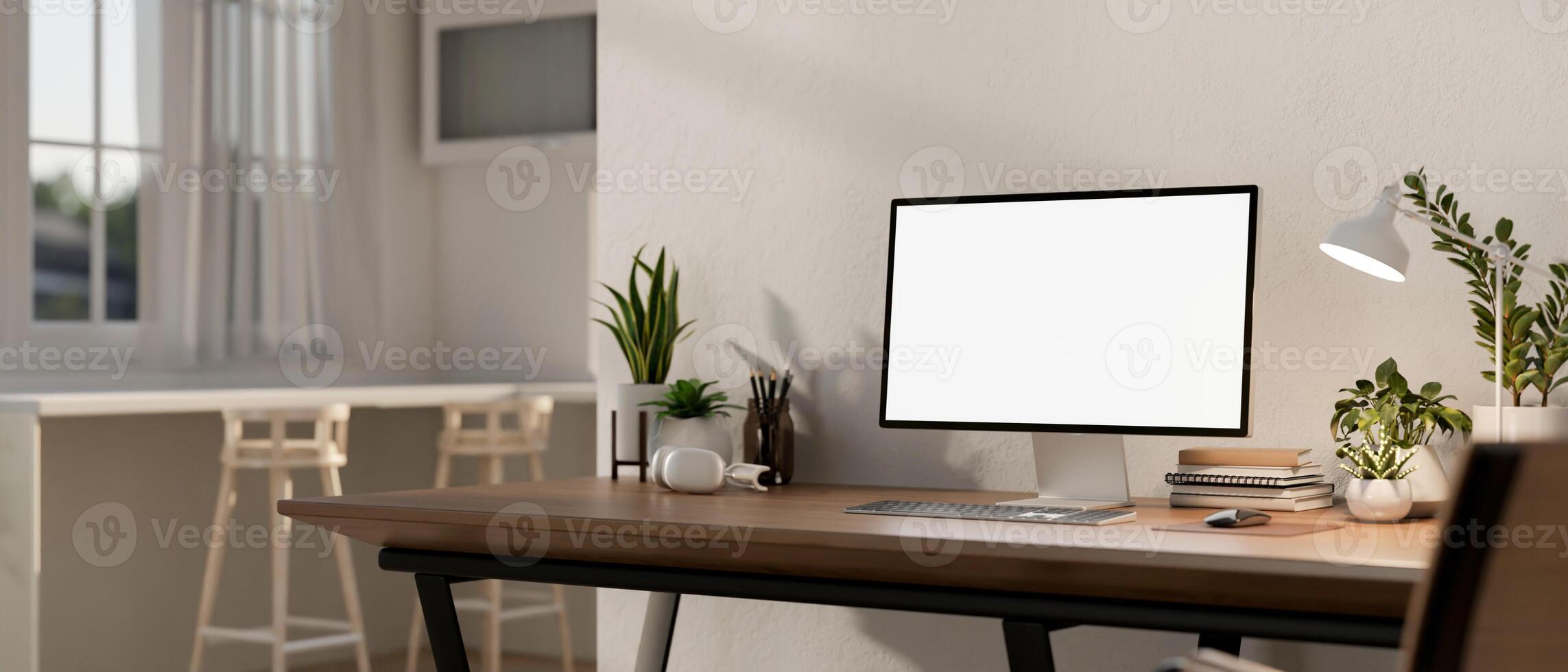 Home workspace features a computer mockup on a wooden table in a contemporary bright room. photo