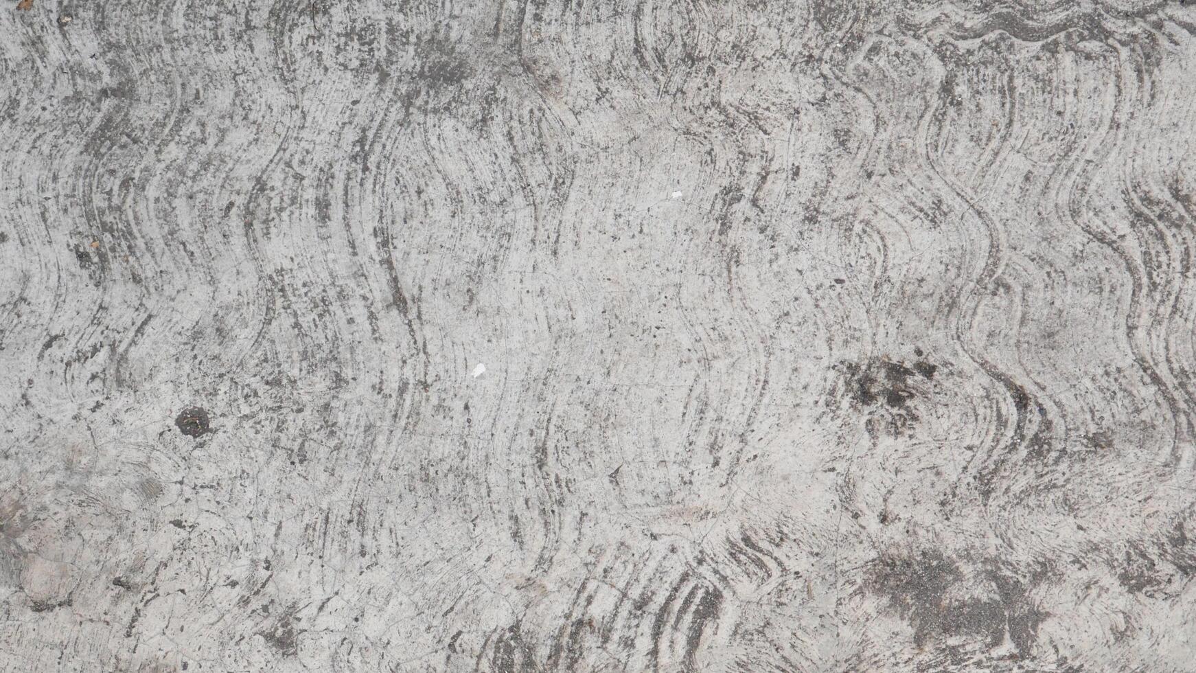 Attractive modern raw and uneven concrete wall surface - handmade gray texture with visible natural traces, texture and mortar structure photo