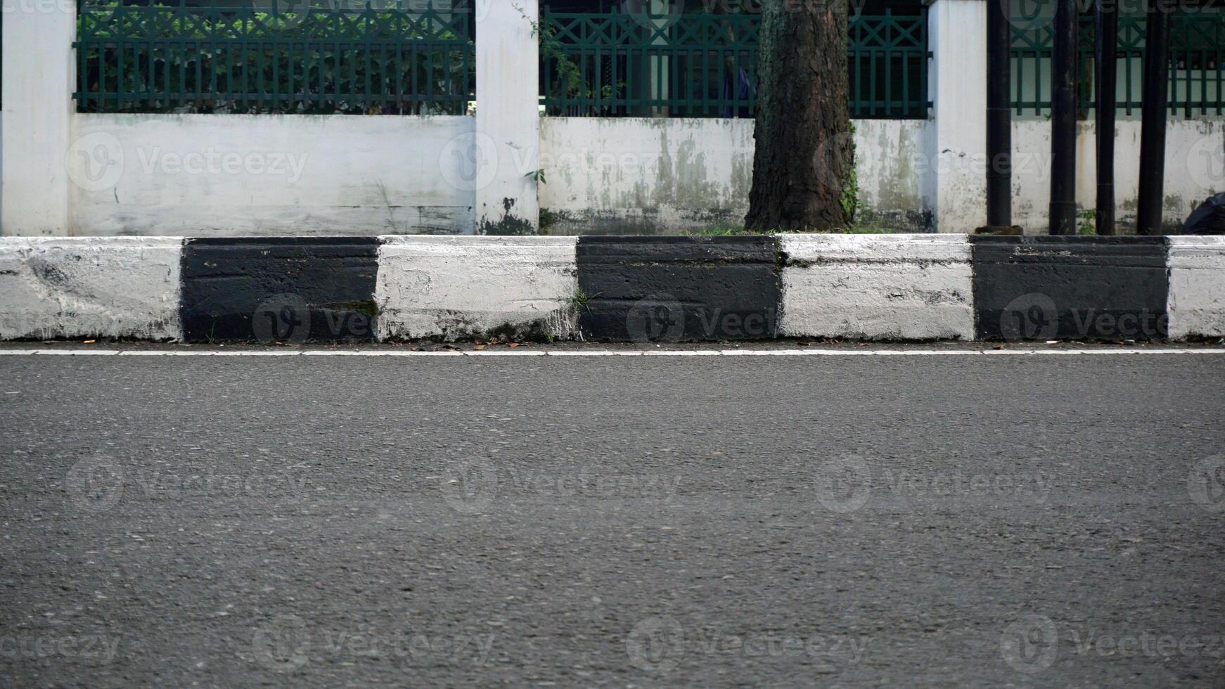 Asphalt road with white and black stripes in the city. photo