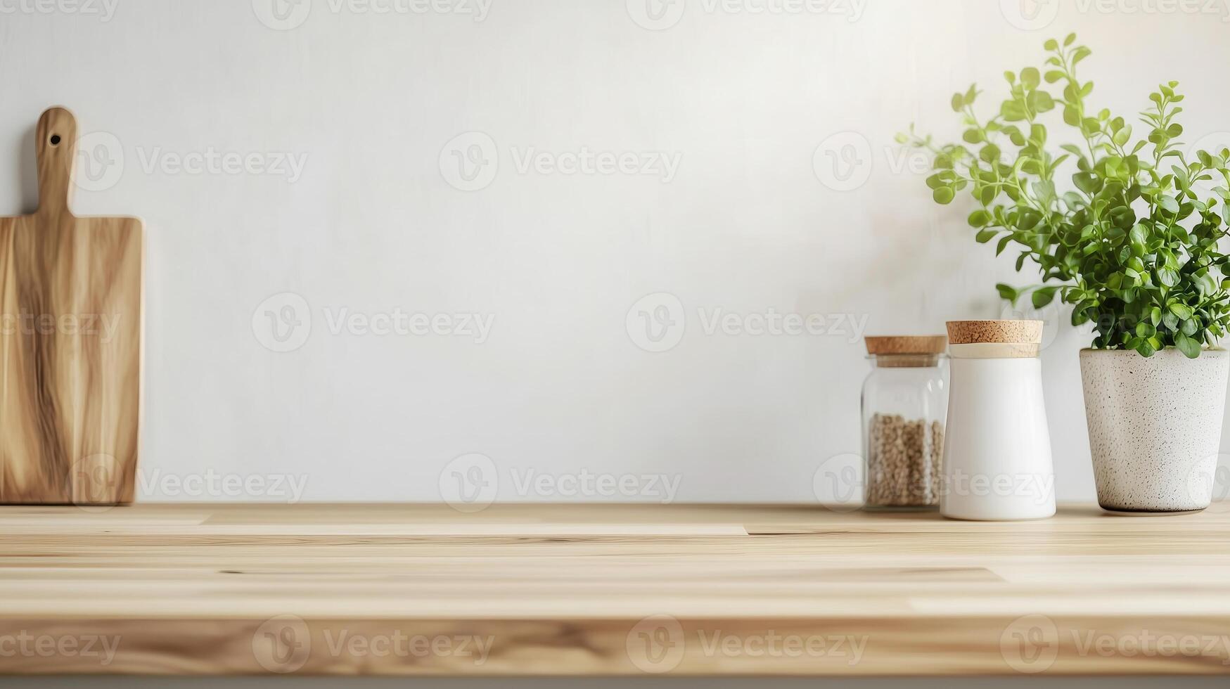 A serene kitchen countertop displaying natural wood, jars, and a potted plant, ideal for culinary and interior design themes. photo