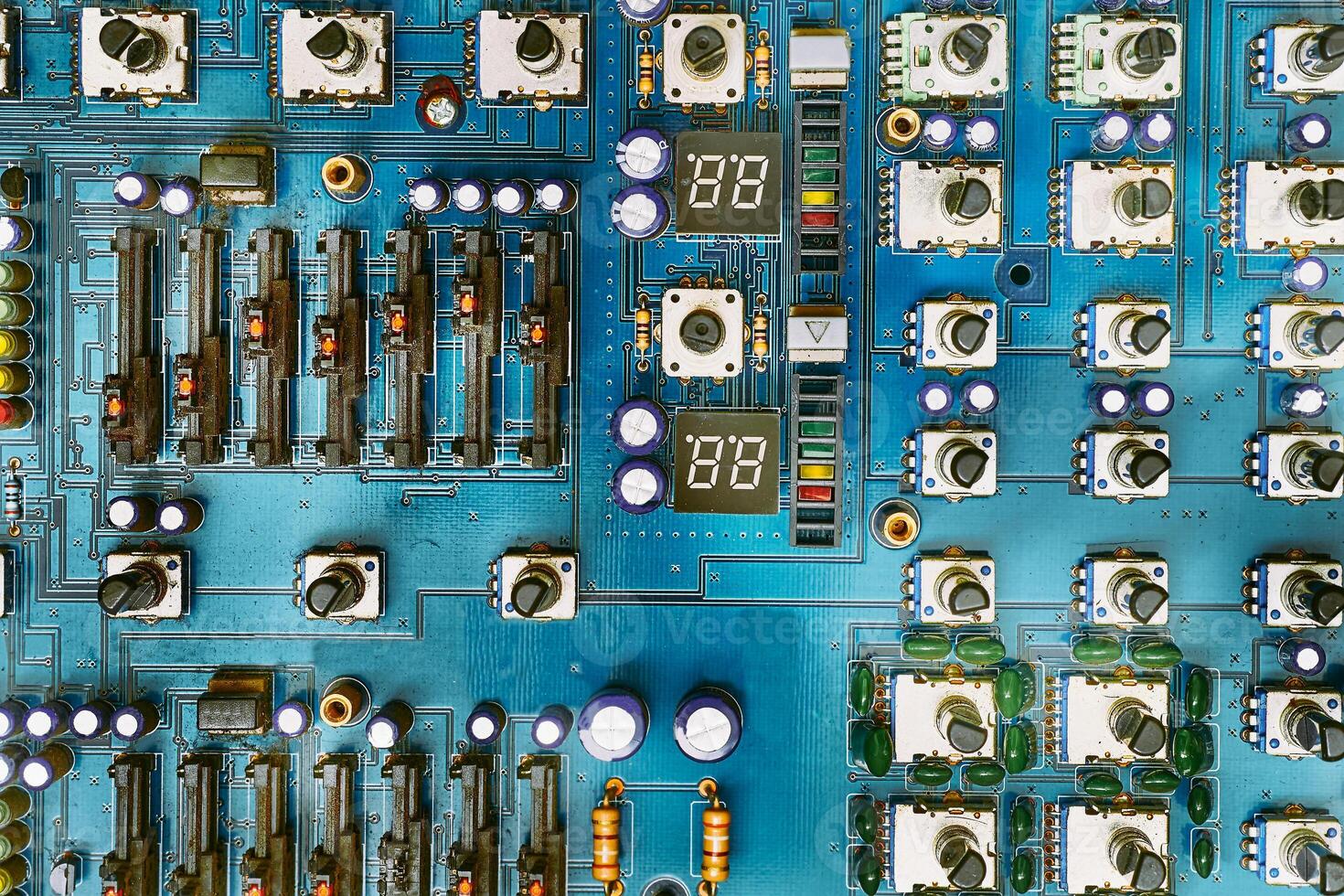 Electronic printed circuit board with with potentiometers and radio components photo