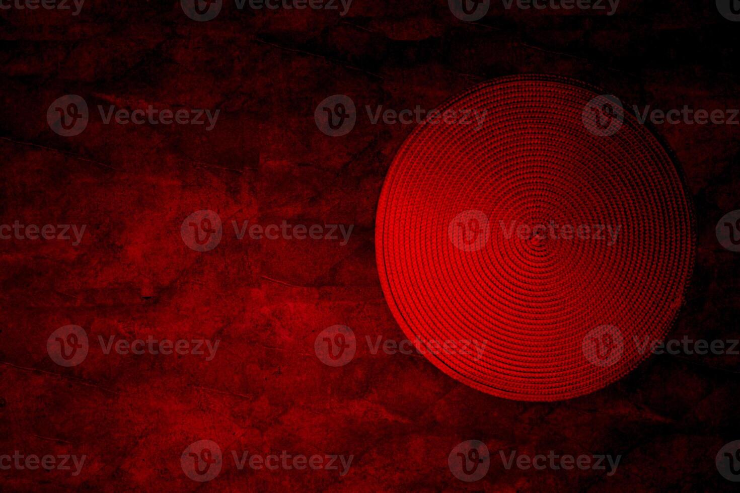 Red spiral straw circle, Far Eastern hat on red marble photo