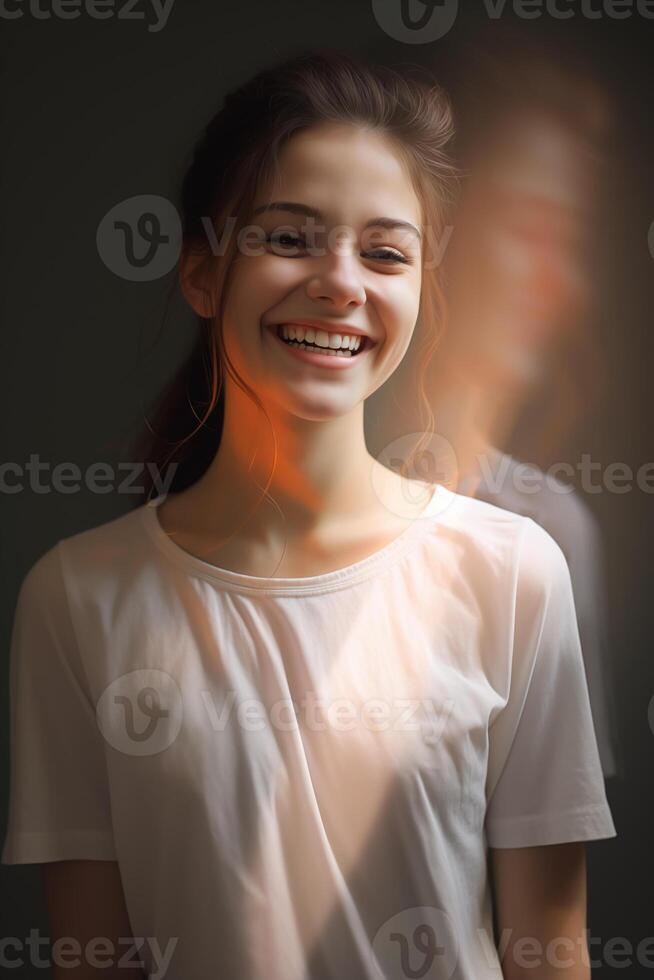 This heartwarming image captures the spontaneous laughter of a young woman, her joy palpable and infectious, set against a dark, subdued background. photo