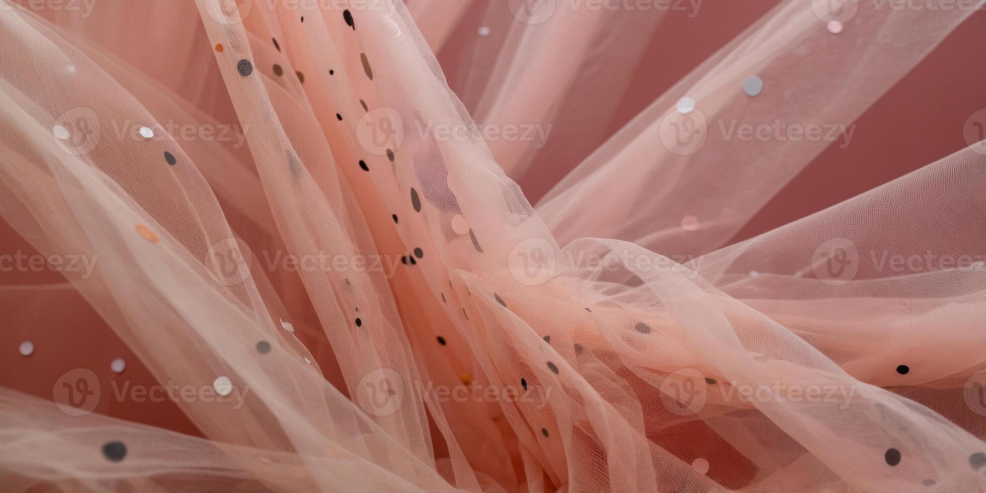 Abstract fashion background of soft floating tulle in bright hues of pink and peach with polka dots. photo