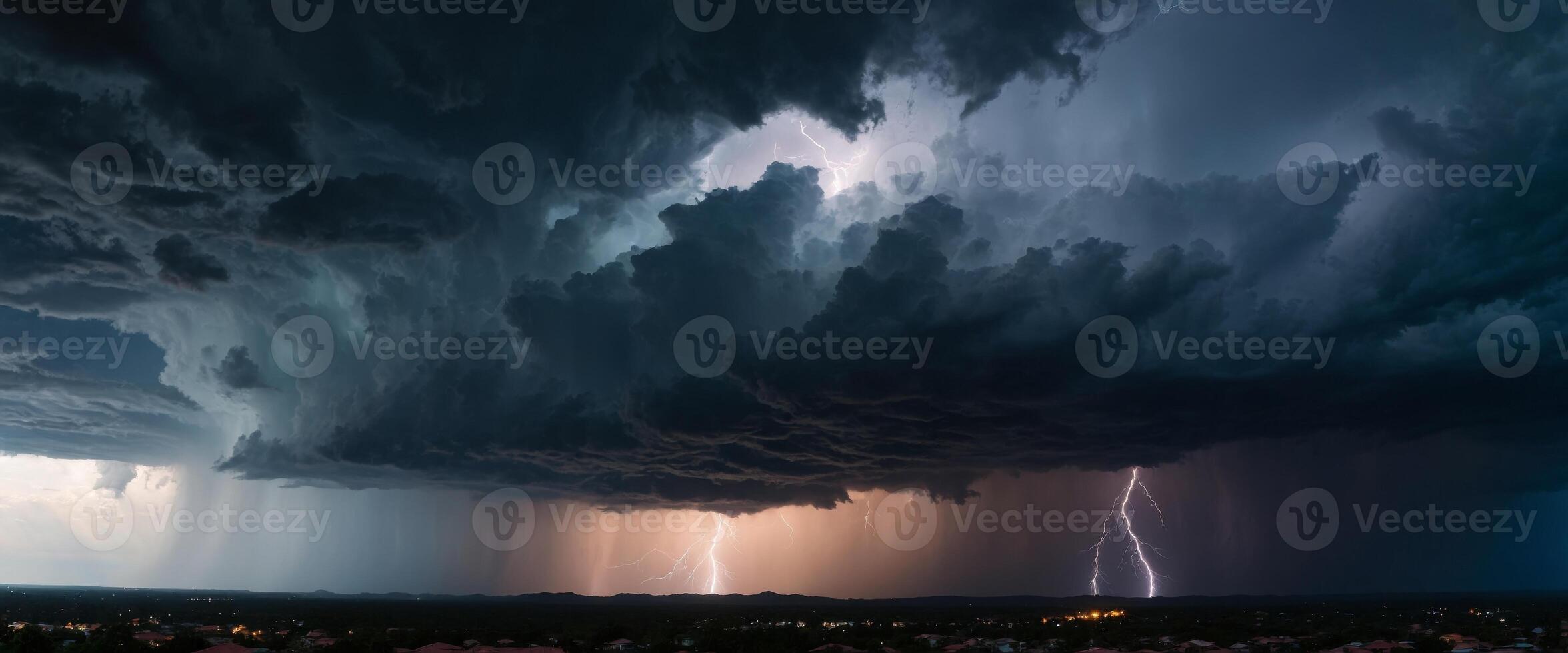 A thunderous dark sky filled with black clouds and flashing lightning This panoramic view captures the theme of weather, natural disasters, storms, typhoons, tornadoes, and thunderstorms. photo