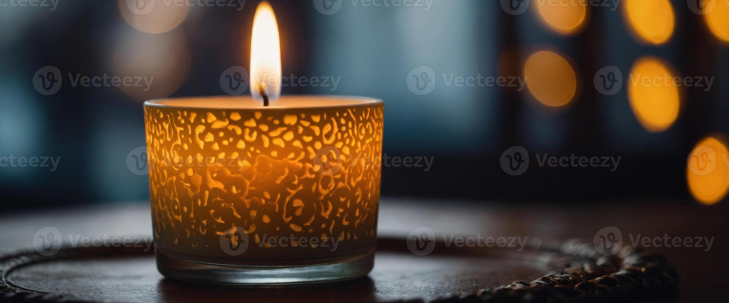 An aromatic scented candle serves as home decor to enhance ambiance. photo