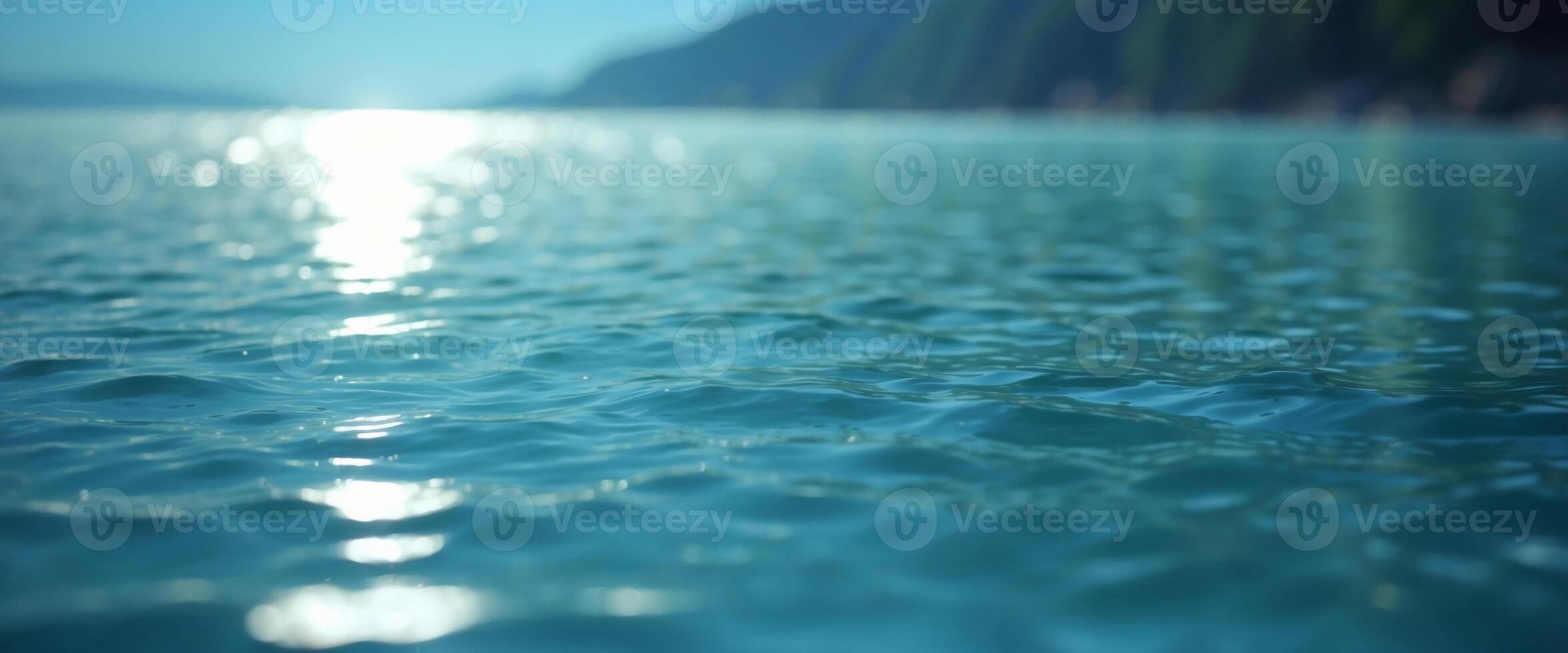 Beautiful background image in form of texture water surface, beautiful light reflections glare in light blue colors. photo
