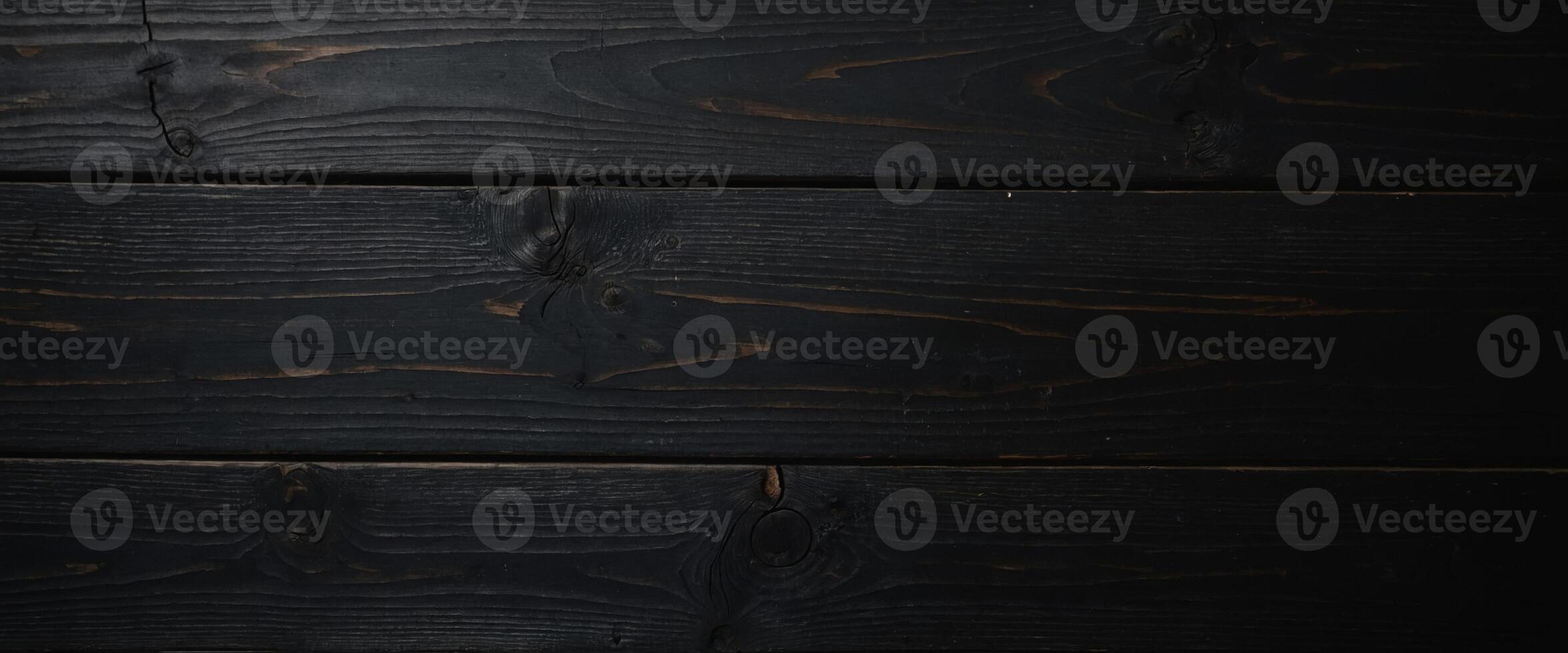 Black wooden surface Macro Top view Free space for text. photo