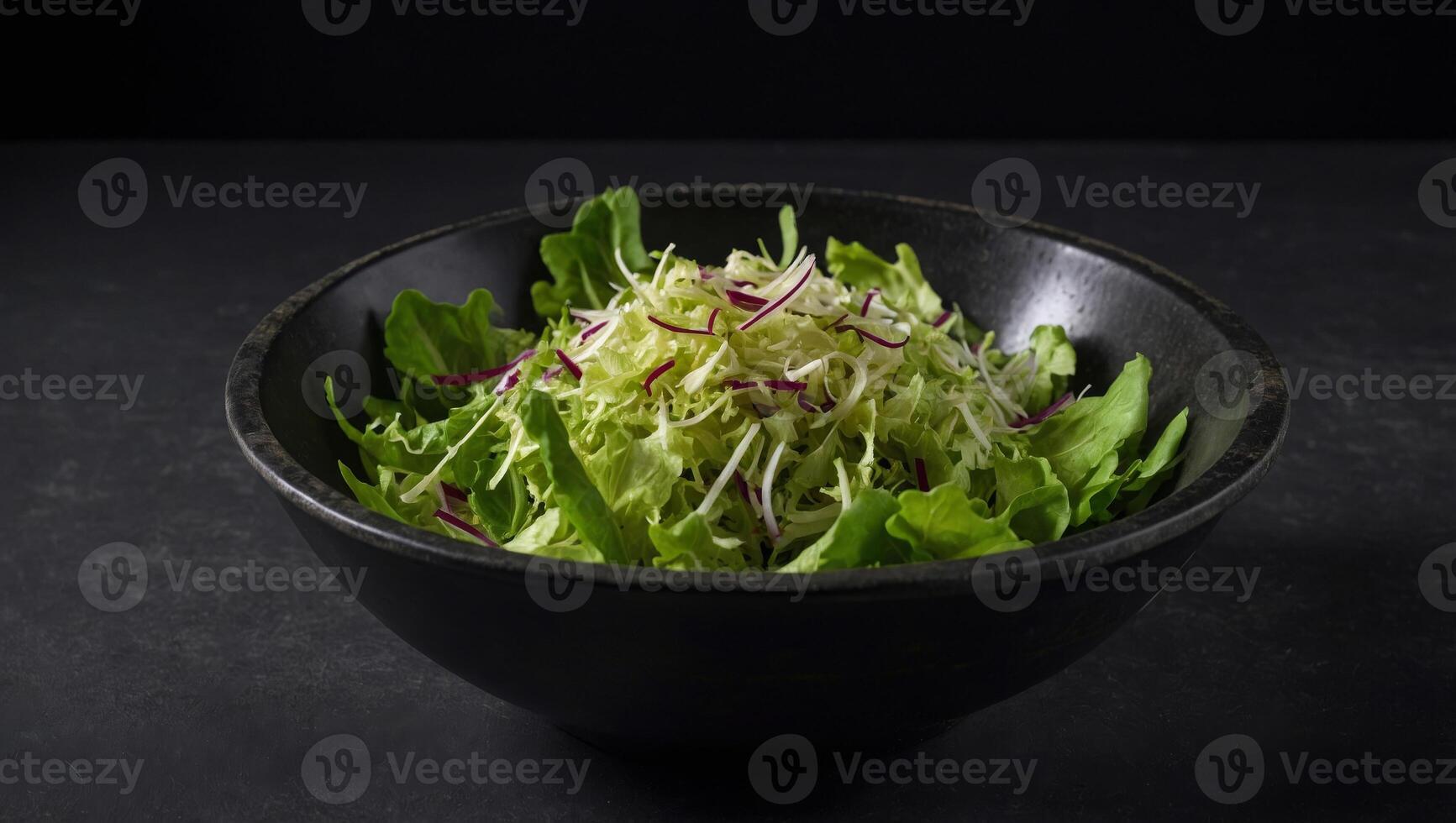 Bowls with mixed shredded salad lettuce fresh leaves, on black background, top view flat lay with copy space for text. photo
