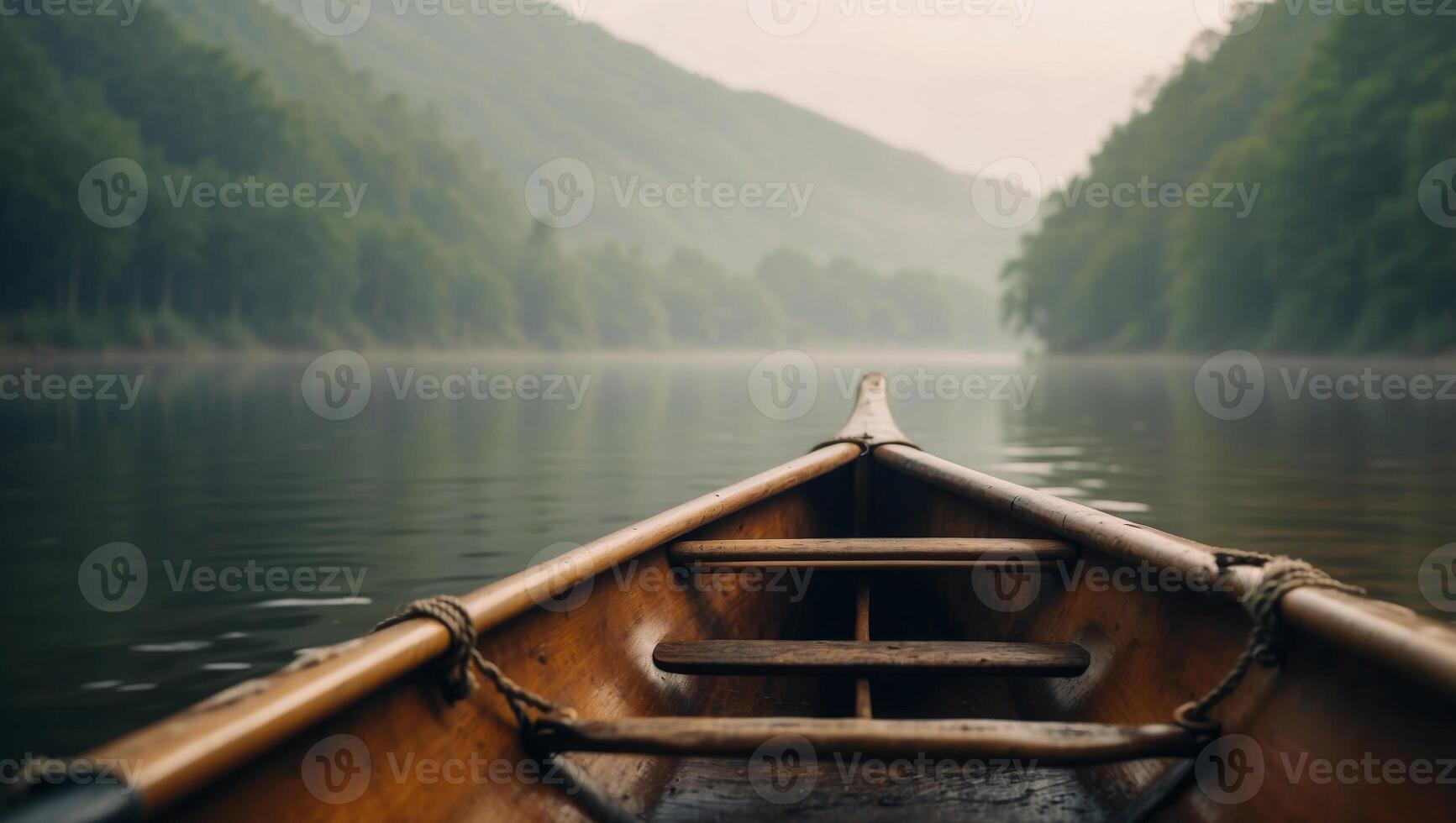 Closeup bow of a modern canoe in the misty lake or river around forest. photo