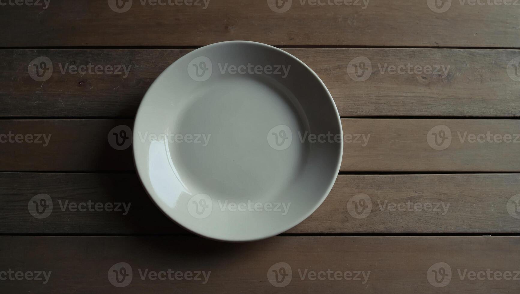 Empty ceramic shape plate for food on the table top view Copy space template for your text. photo