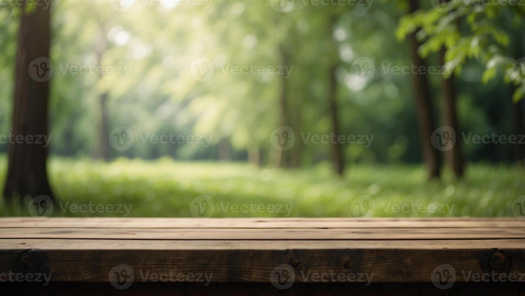 Empty wooden table in front of green forest background Ready for product display montage. photo