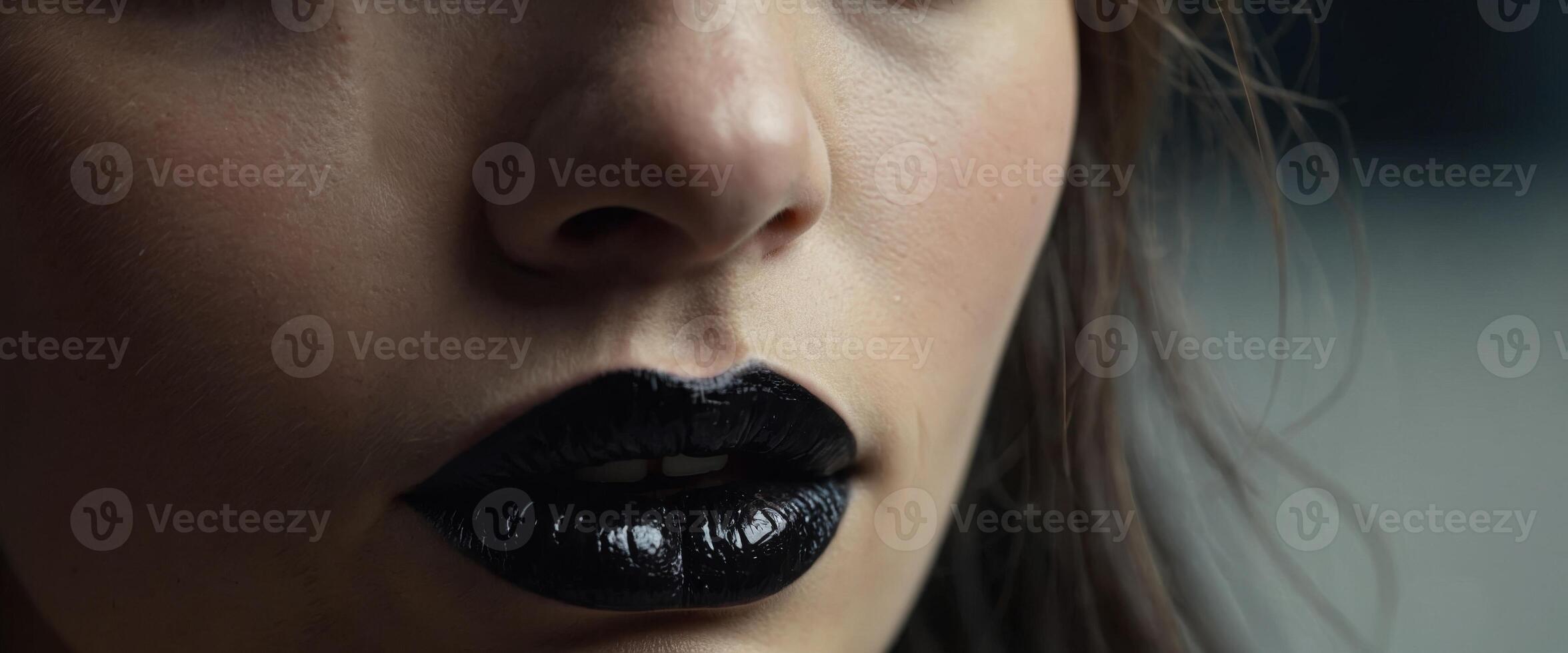Girl's face with black lips Macro Close up photography For advertising beauty salons. photo