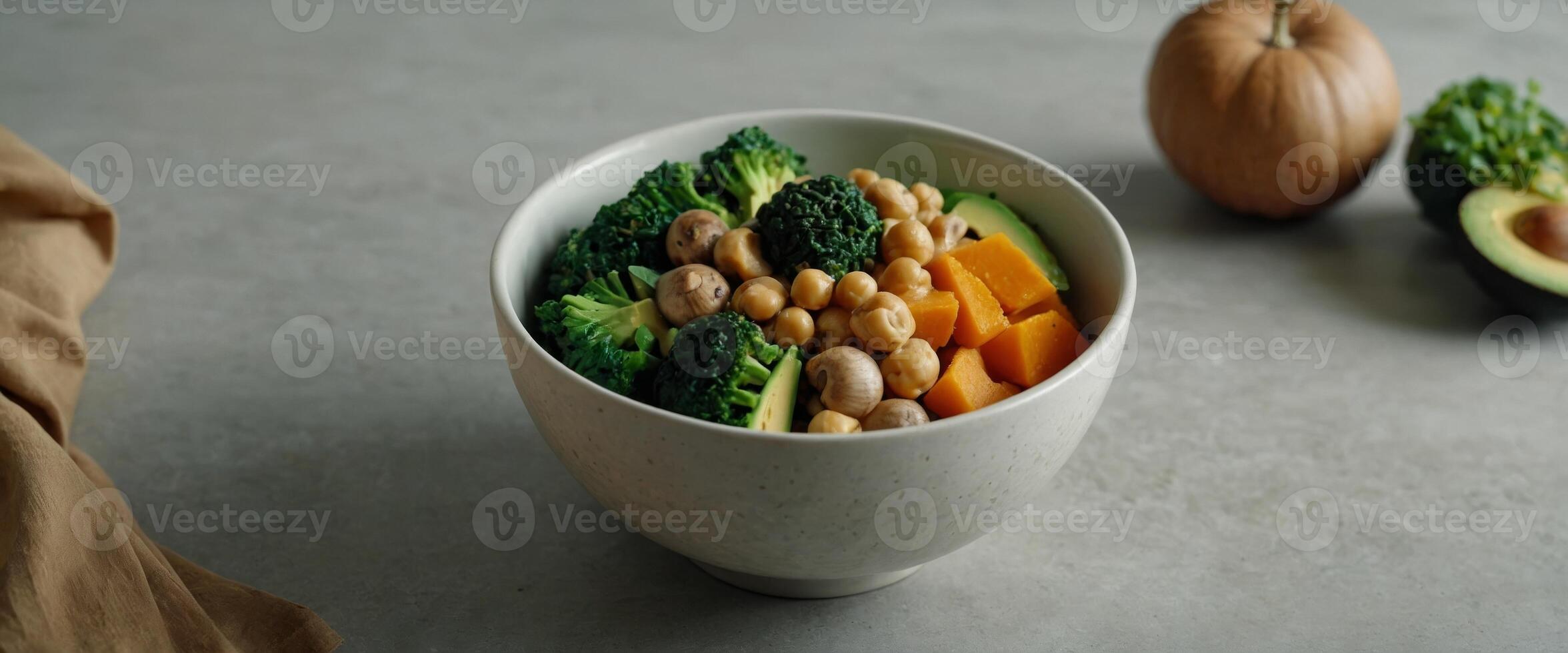 Healthy vegan lunch bowl with Avocado, mushrooms, broccoli, spinach, chickpeas, pumpkin on a light background vegetables salad Top view. photo