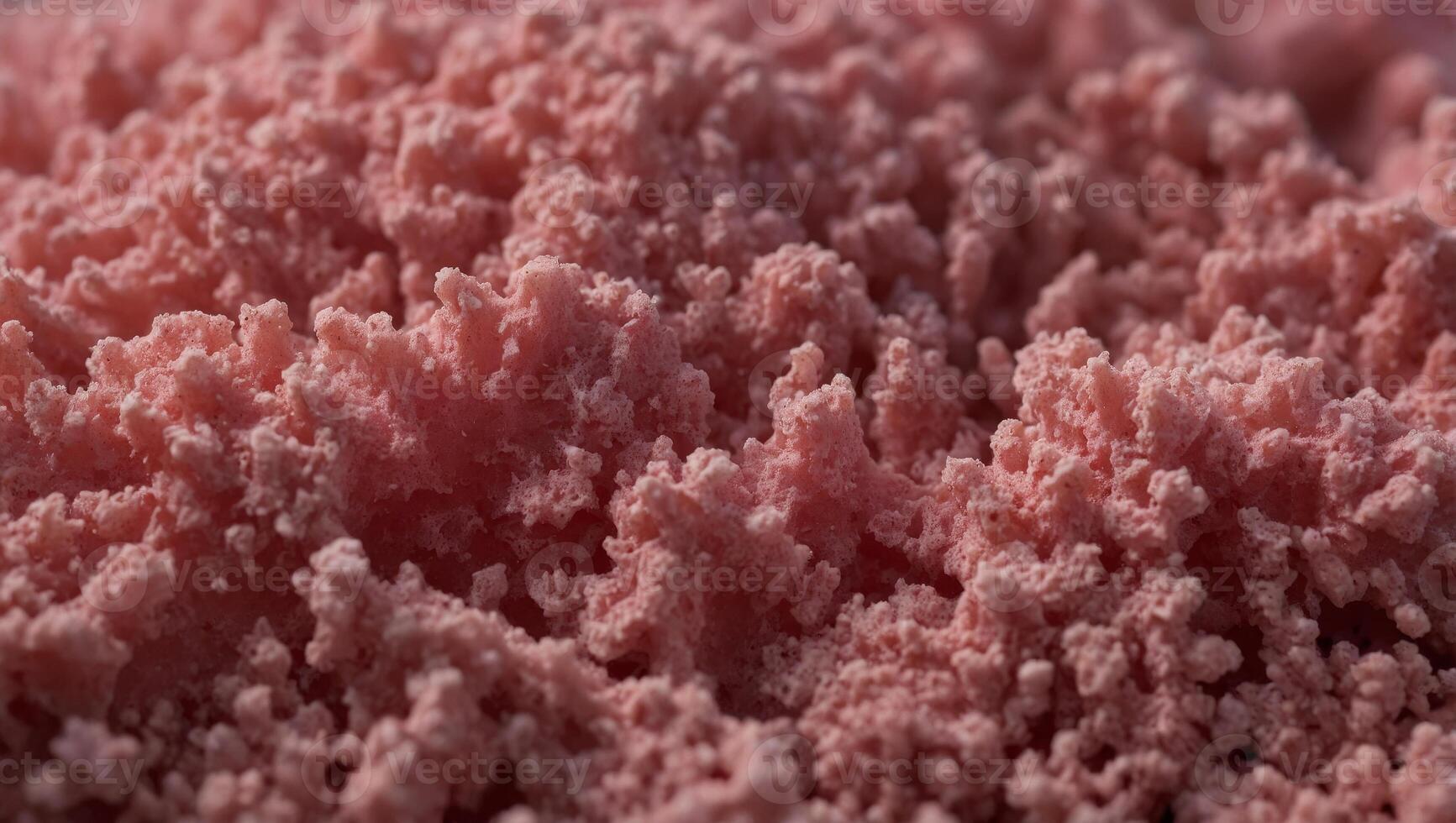 Texture of a porous pink sponge close up Cellulose pink sponge micro plastic made from foam. photo