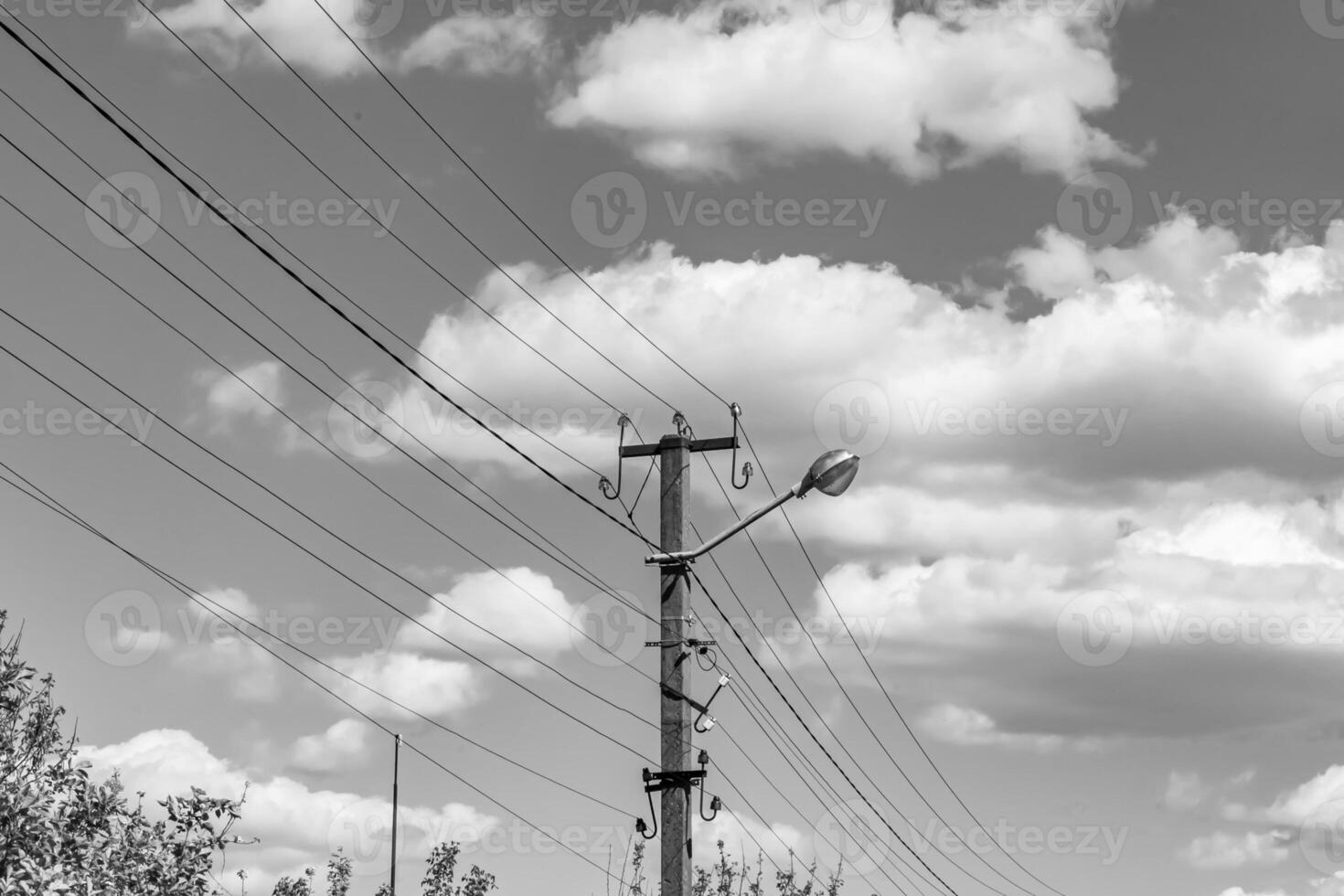 Power electric pole with line wire on light background close up photo