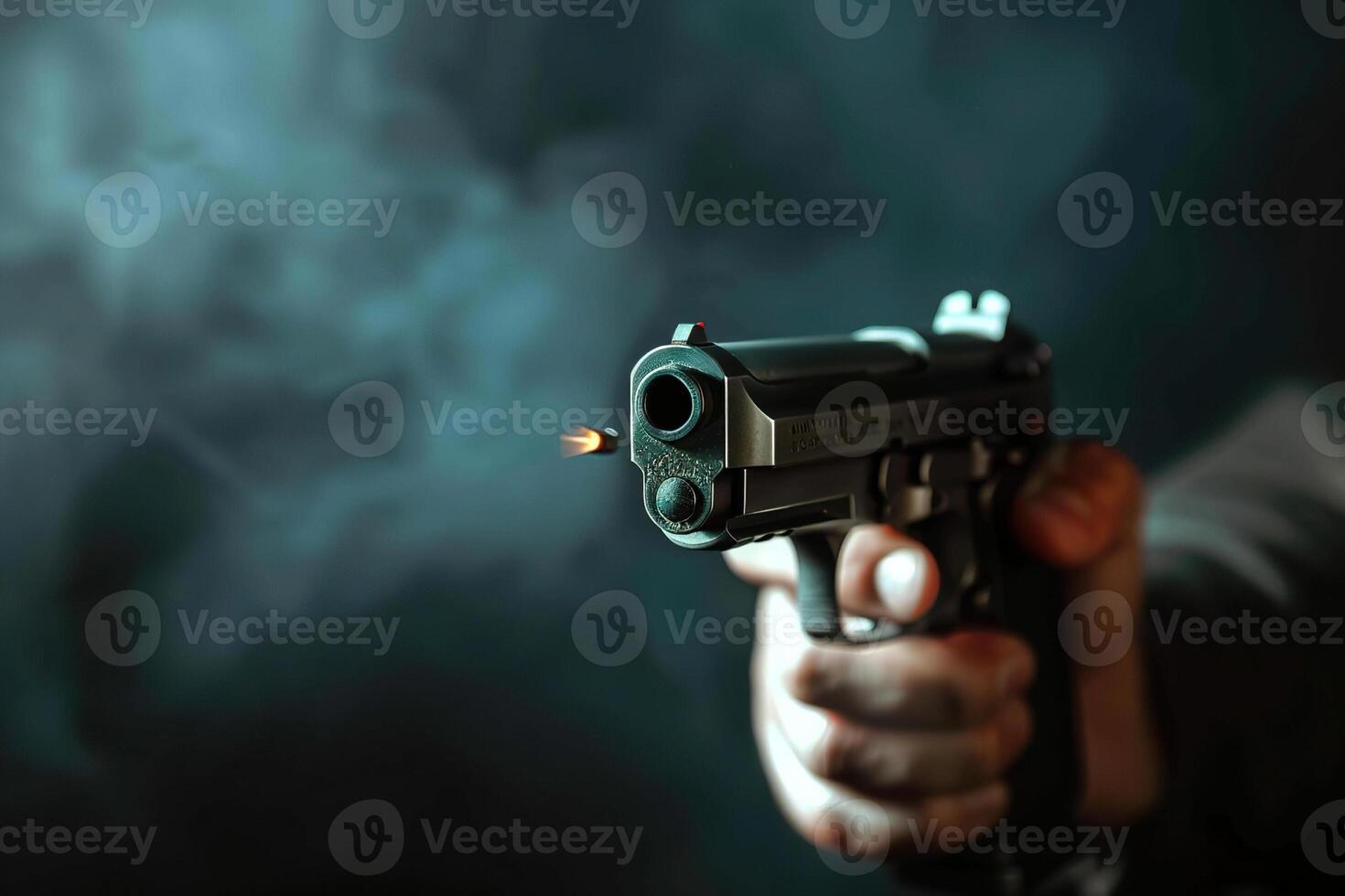 Man aims through the sight of combat metal pistol to hit the target photo