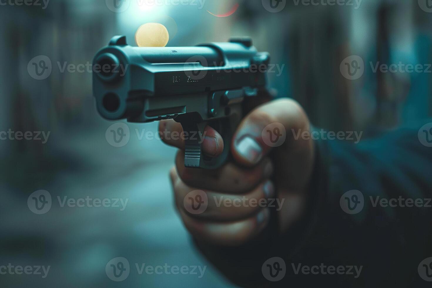 Man aims through the sight of combat metal pistol to hit the target photo