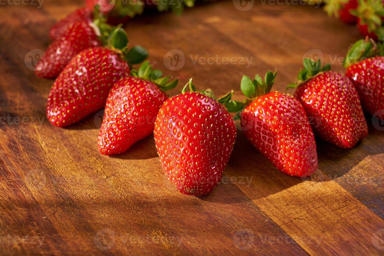 organic strawberries on a wooden cutting board photo