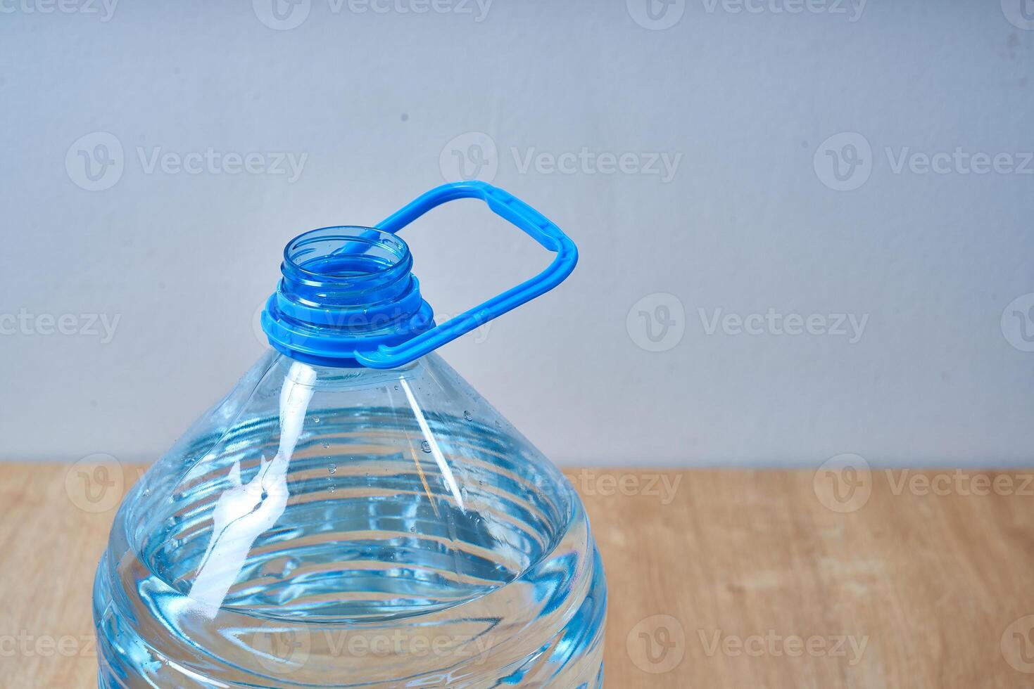 5 liter blue plastic water bottle photo