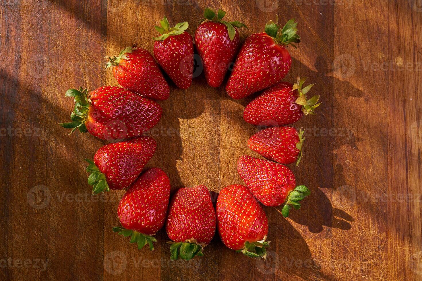 organic strawberries on a wooden cutting board photo