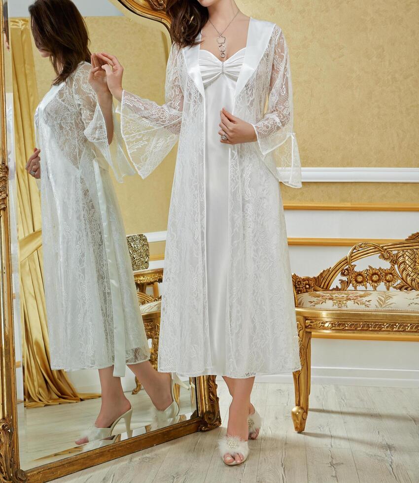 Female fashion model wearing a satin nighty in an hotel room. photo