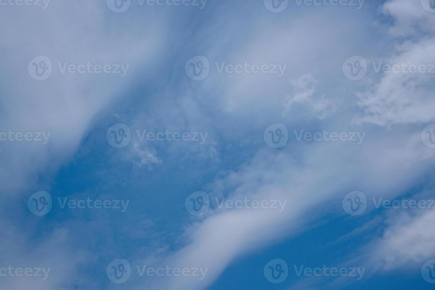Blue summer sky and puffy white clouds photo
