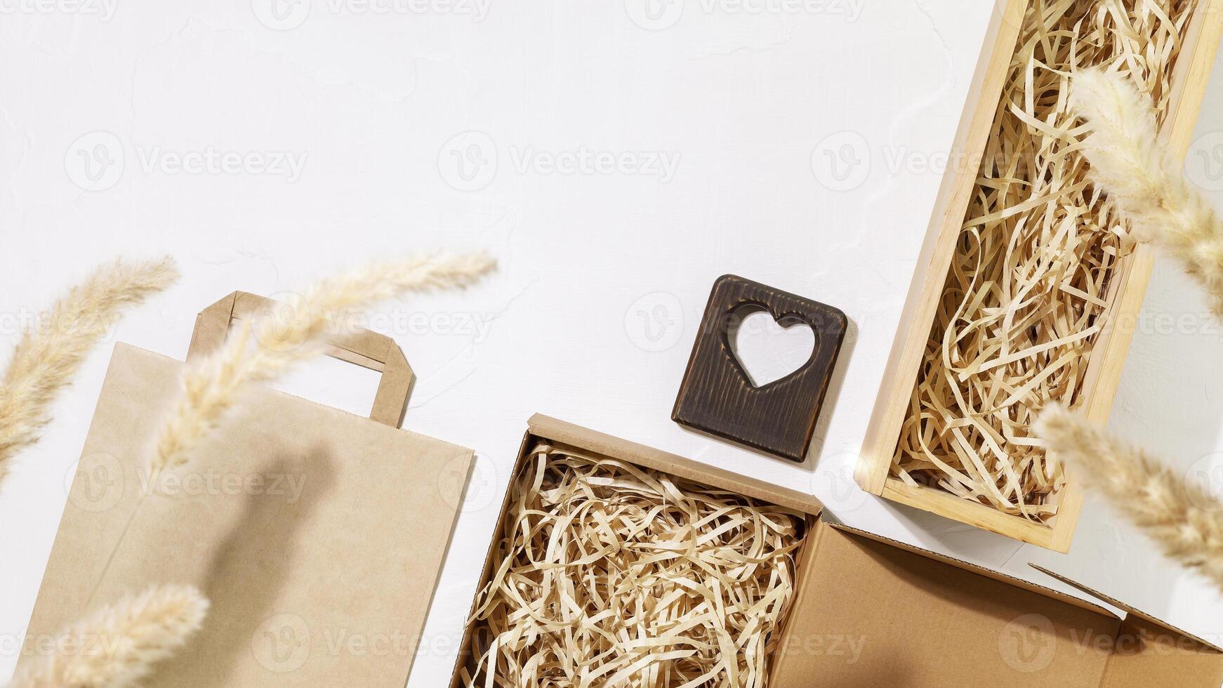 Set of cardboard boxes with shredded paper inside, paper bag photo