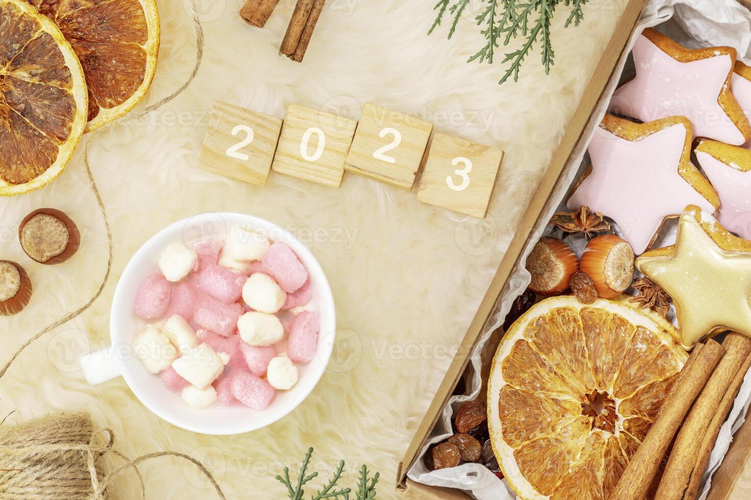 gifts with home made cookies, dry fruits, nuts on a white fur background photo