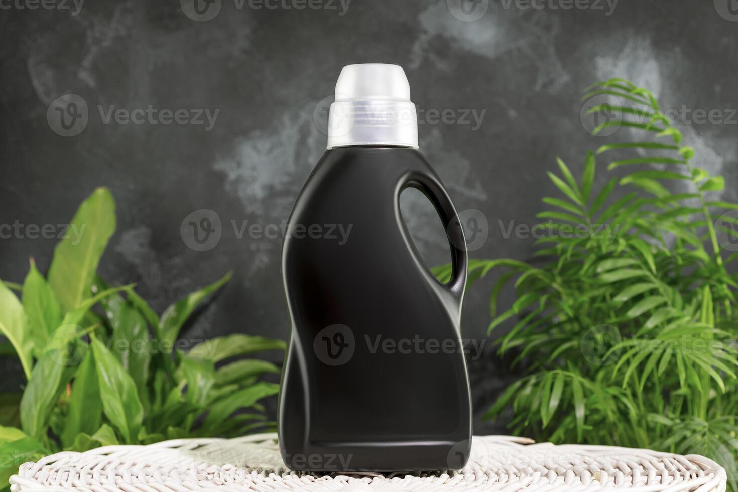 Washing detergent concept with bottle of washing gel or fabric softener photo