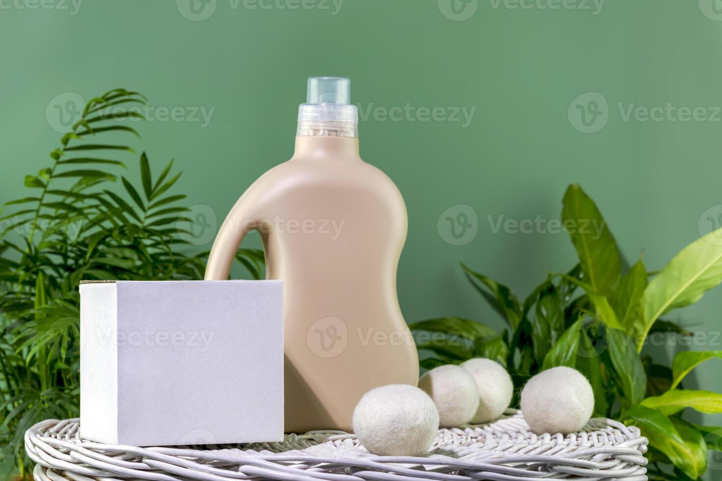 Bottle of washing gel or fabric softener and box with detergent powder photo