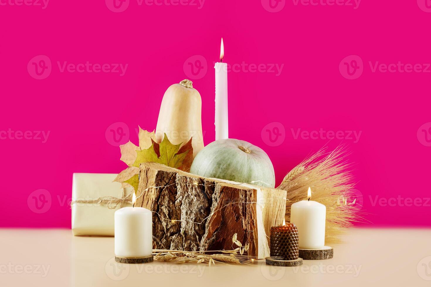 Thanksgiving holiday card with pumpkins, dry leaves and candles photo