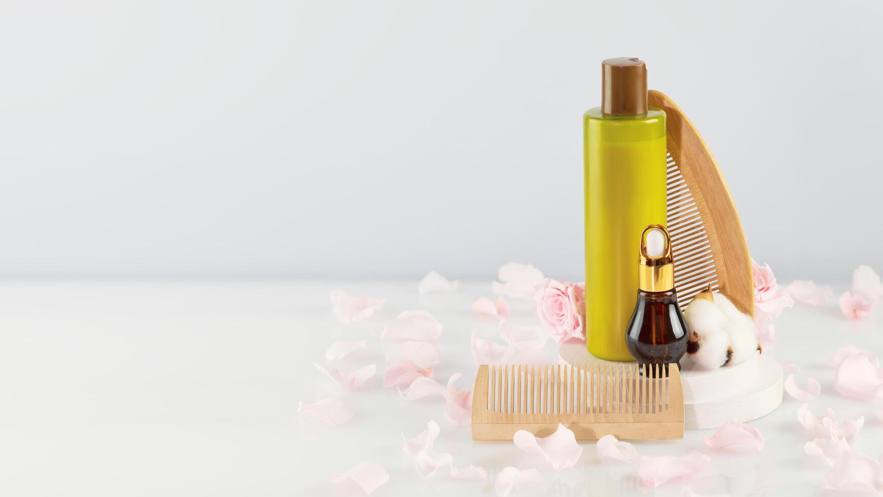 Bottle with beauty product, dropper bottle, comb and copy space photo