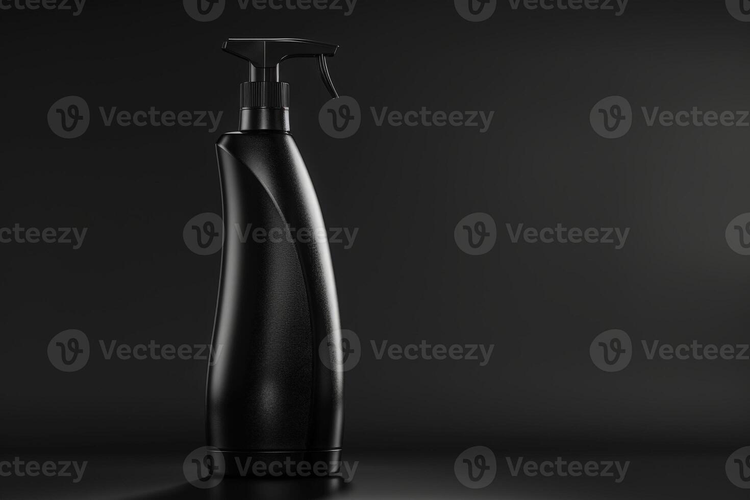 A black shampoo bottle with a pump top sits on a black surface against a black background. The bottle is tall and slender, with a curved shape. The pump top is silver and has a black nozzle. photo