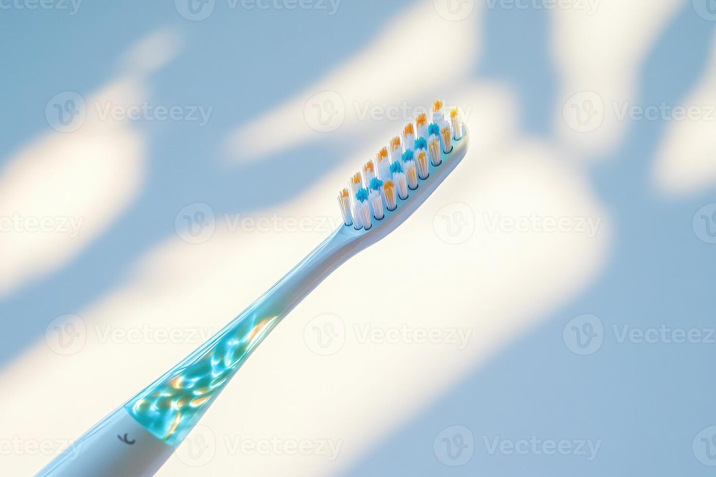 A sleek electric toothbrush stands alone, reflecting gentle light, emphasizing its modern design and functionality. photo