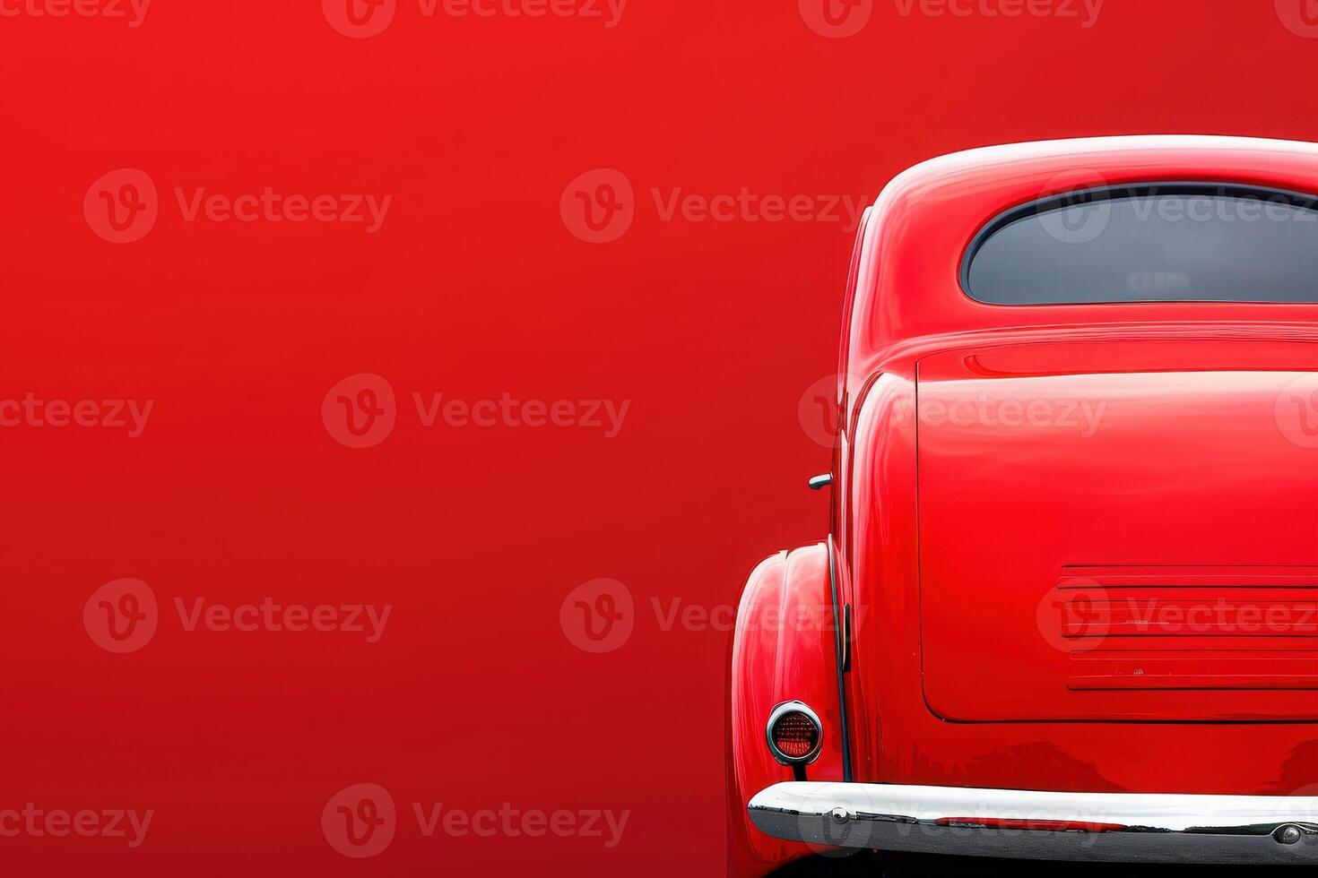A slightly crumpled fender in vibrant red stands isolated, projecting nostalgia and artistic flair on a striking crimson background. photo