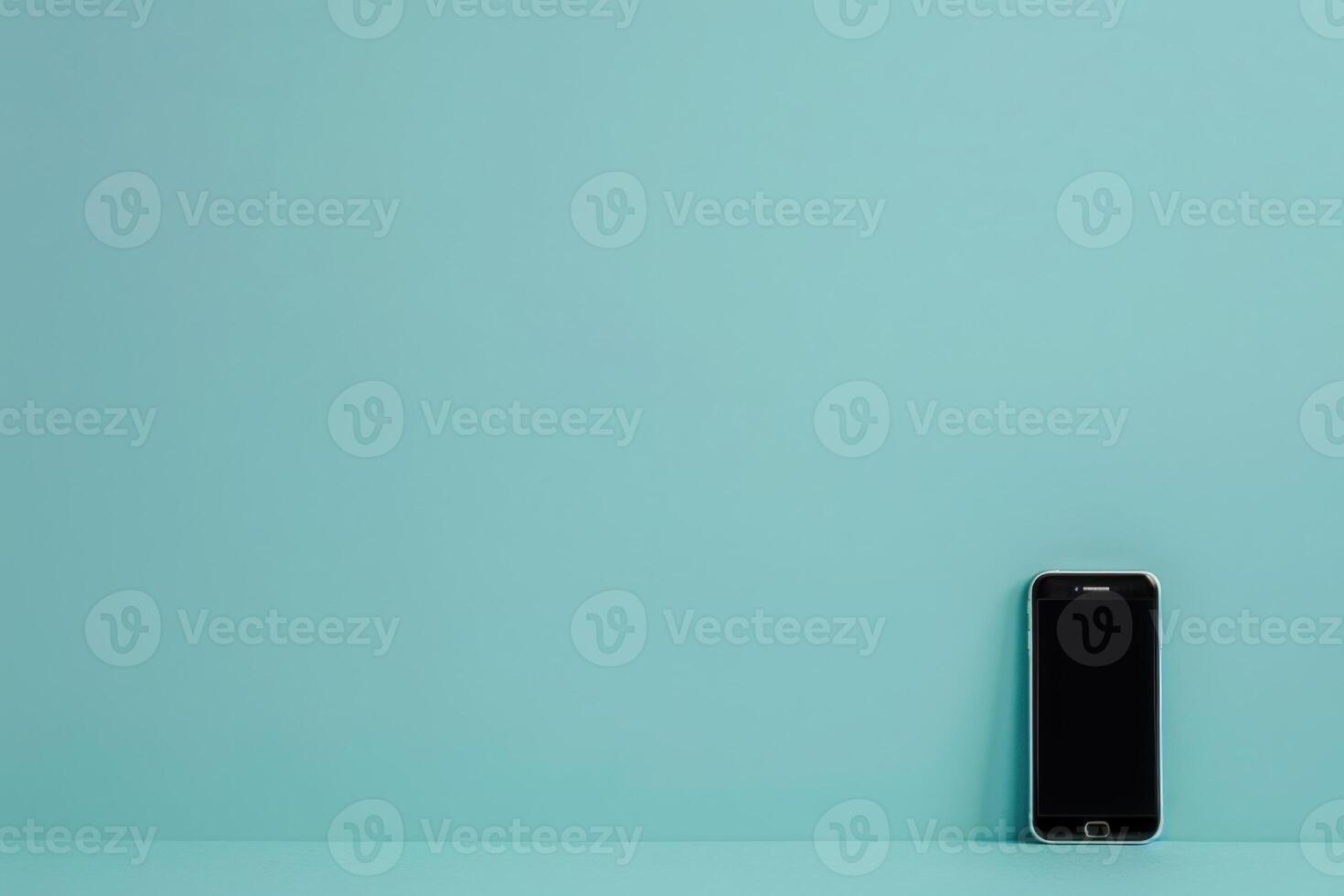 A modern smartphone stands against a clean, pastel backdrop, symbolizing simplicity and effective contact organization. photo