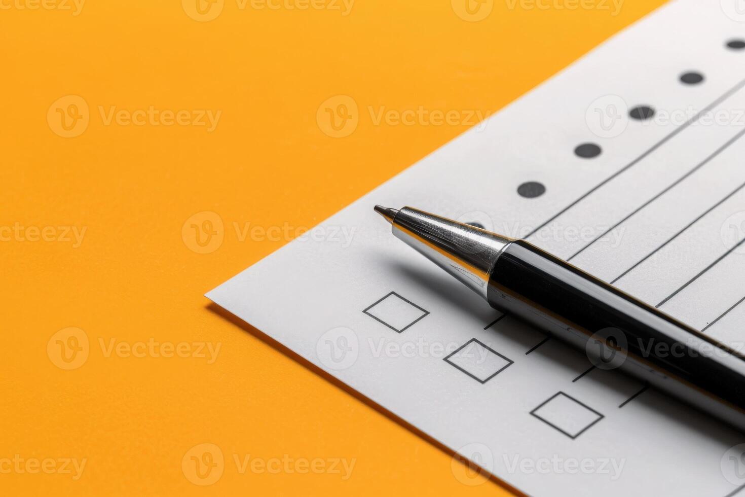 A neatly arranged feedback form sits on a cheerful yellow surface, accompanied by a sleek pen, inviting responses and engagement from users. photo
